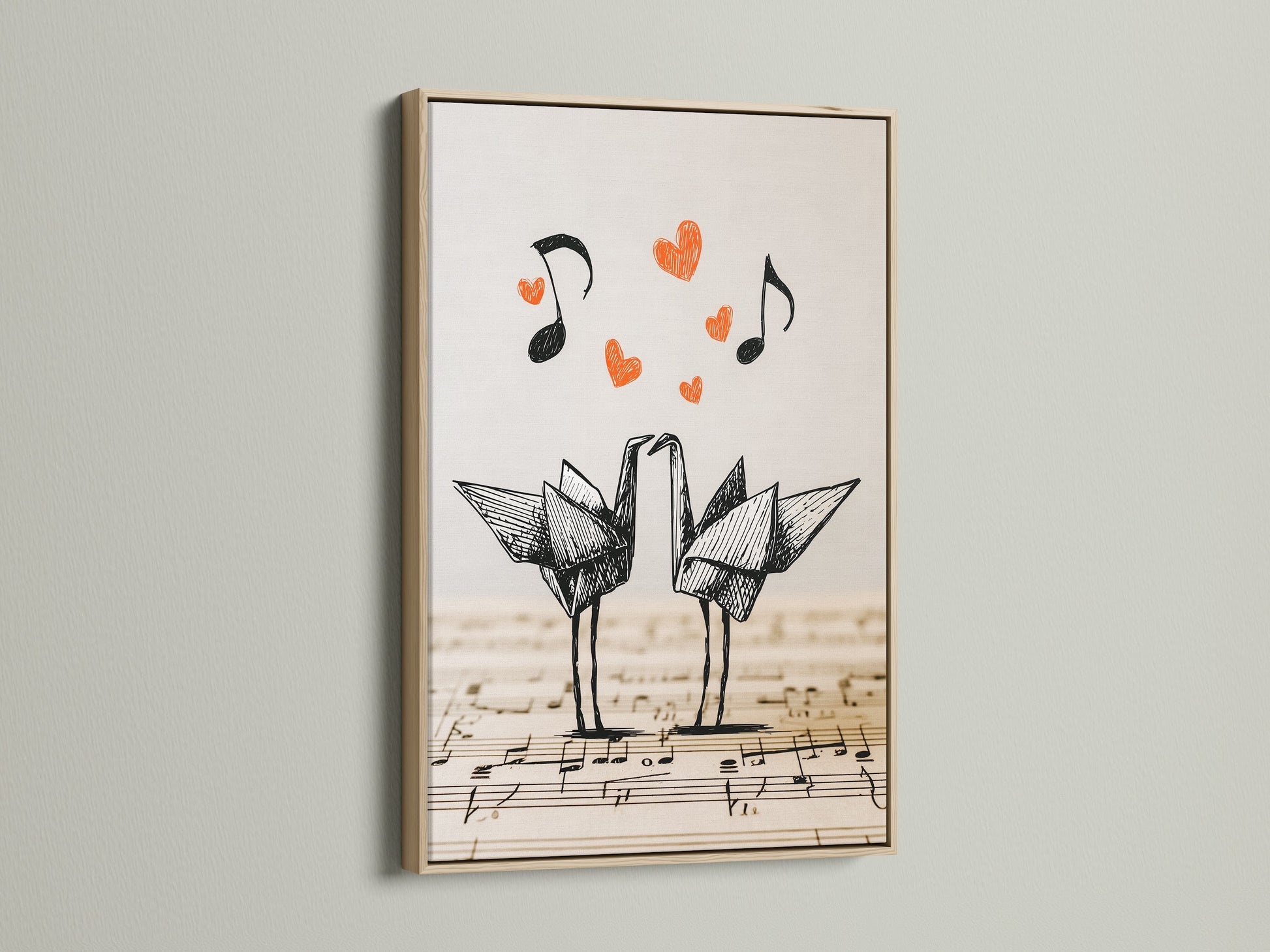 Framed origami cranes artwork in an oak frame. The artwork shows two origami cranes standing on a music sheet. Red hearts and music notes add a touch of whimsy. This oak frame enhances the minimalist style.
