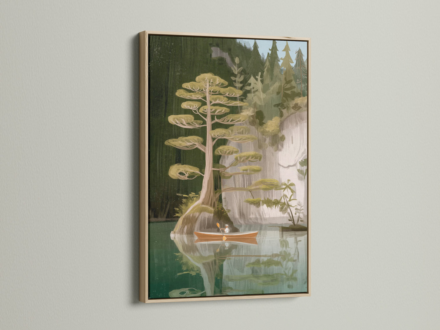 Lake and Canoe artwork with an oak frame. This frame enhances the natural beauty of the scene. The oak frame provides a warm rustic touch. Perfect for cabin decor or any space seeking a woodland print. Discover the beauty of nature wall art.