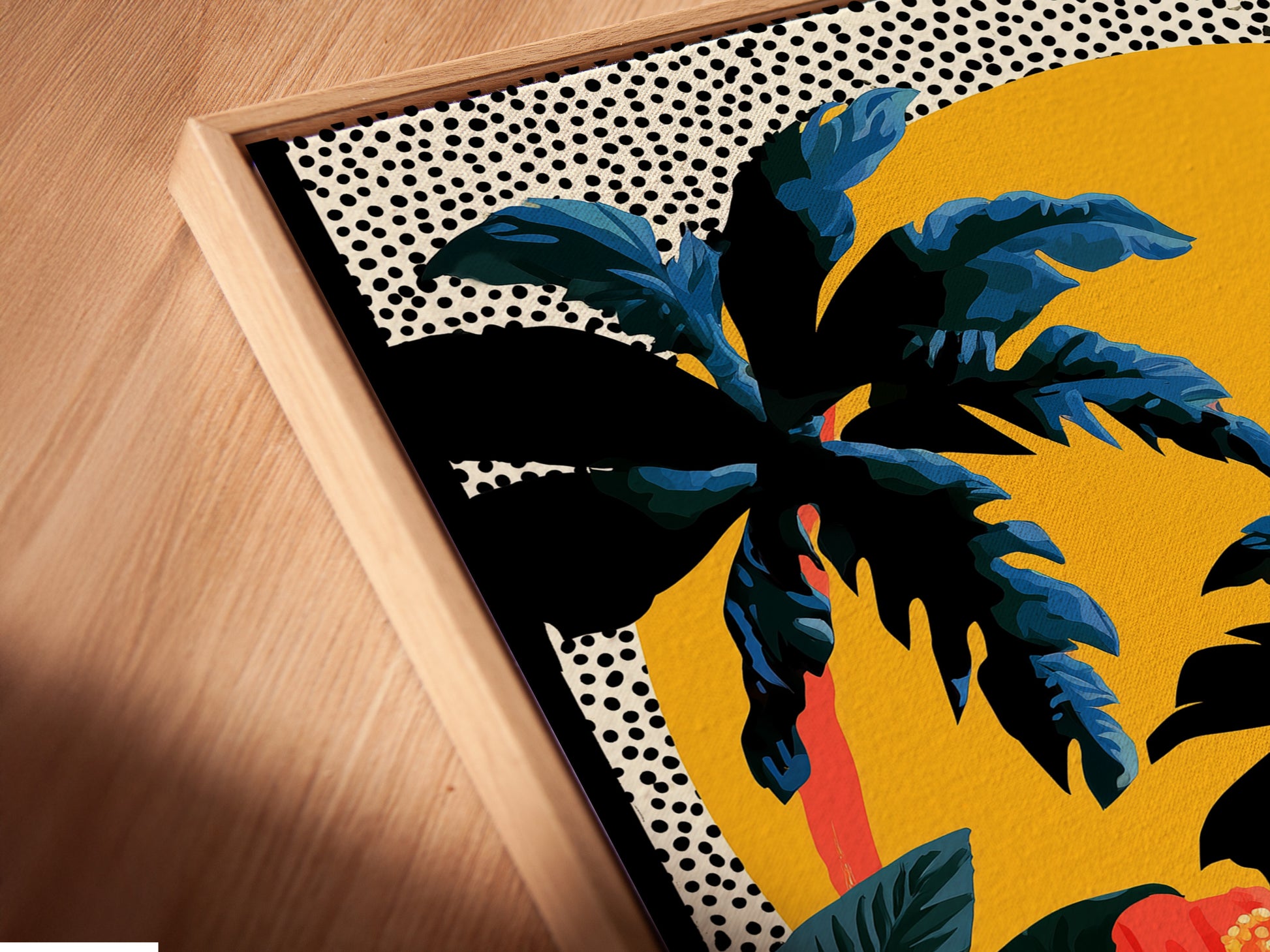 The image shows a close up of a canvas print in a floating frame. The artwork has palm trees hibiscus flowers and a sun against a dotted background. The floating frame adds a modern touch to the artwork. The artwork is mounted on a white wall.