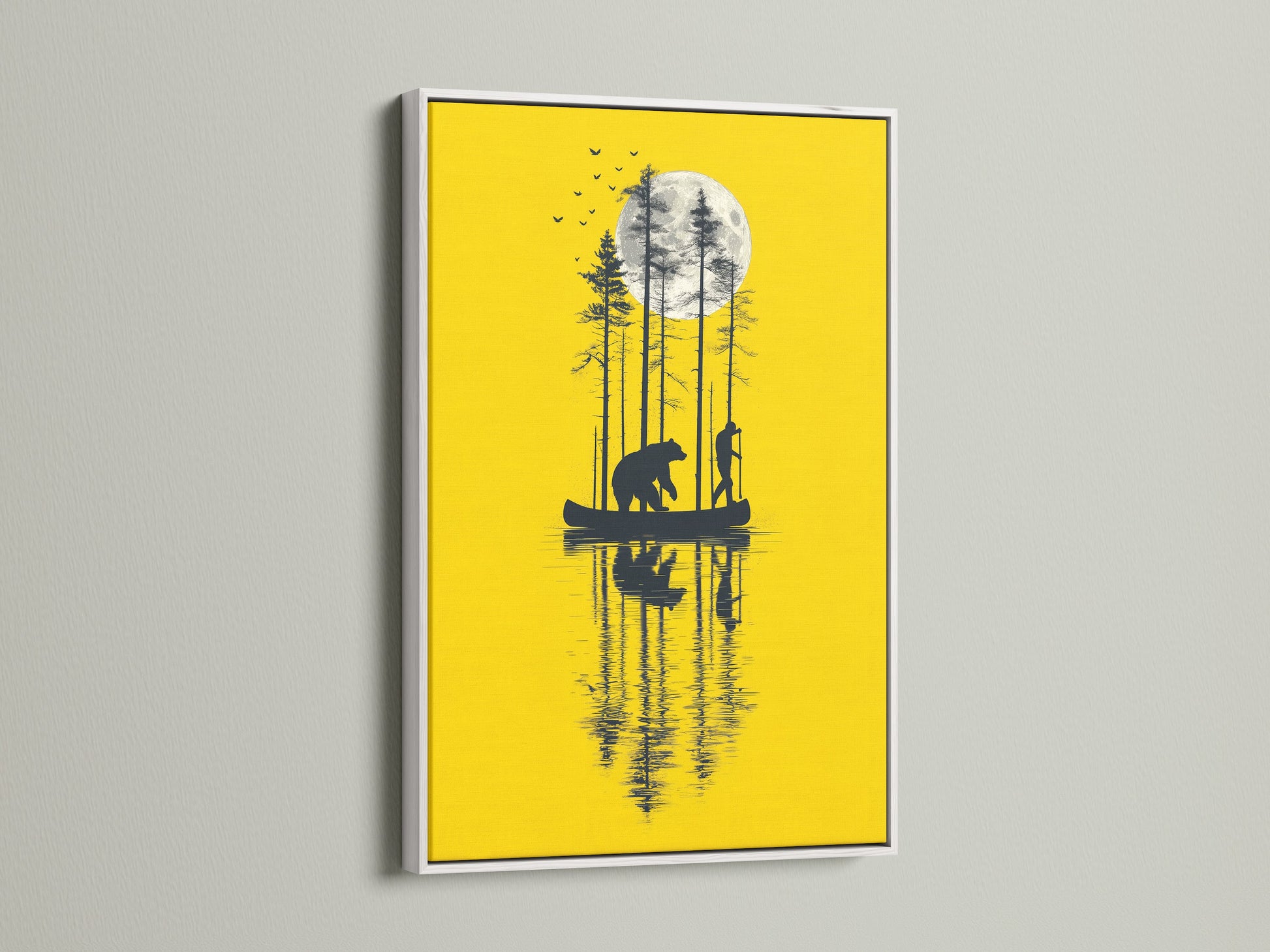 The bear and canoe artwork is presented in a white frame. The yellow wall art makes a statement in any room. The nature canvas adds a touch of rustic charm. This piece is ideal for living room wall art. The silhouette art enhances bedroom wall decor.