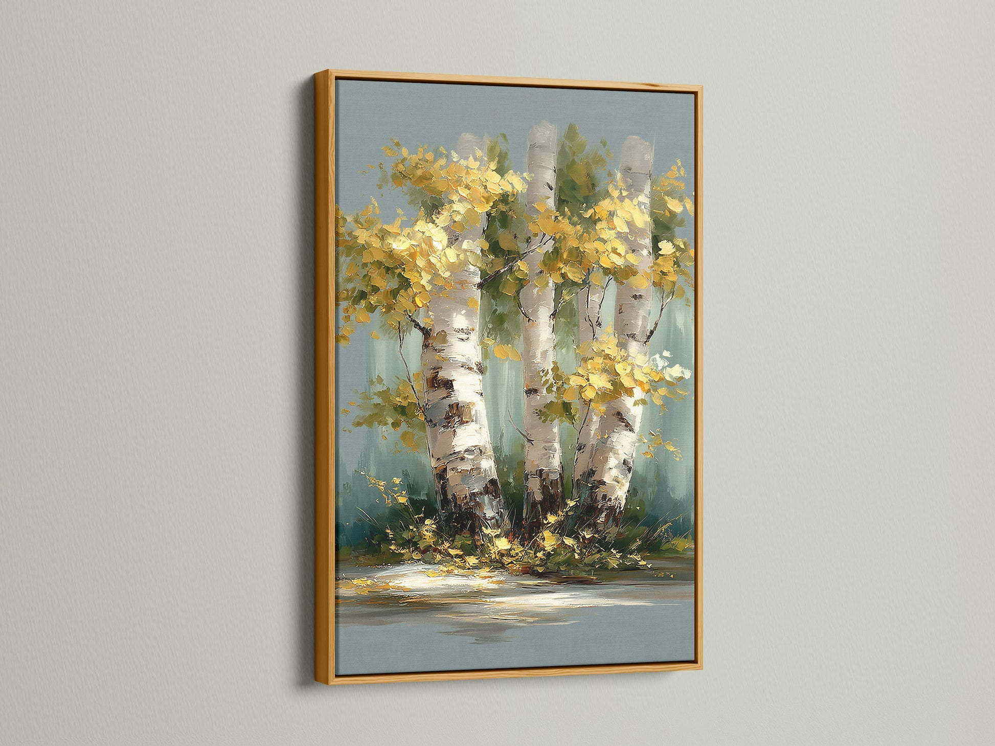 Birch Tree Canvas Print with a gold frame. The golden frame complements the yellow tree art. This autumn wall art is perfect for bedrooms. The forest canvas adds a rustic touch to any space.