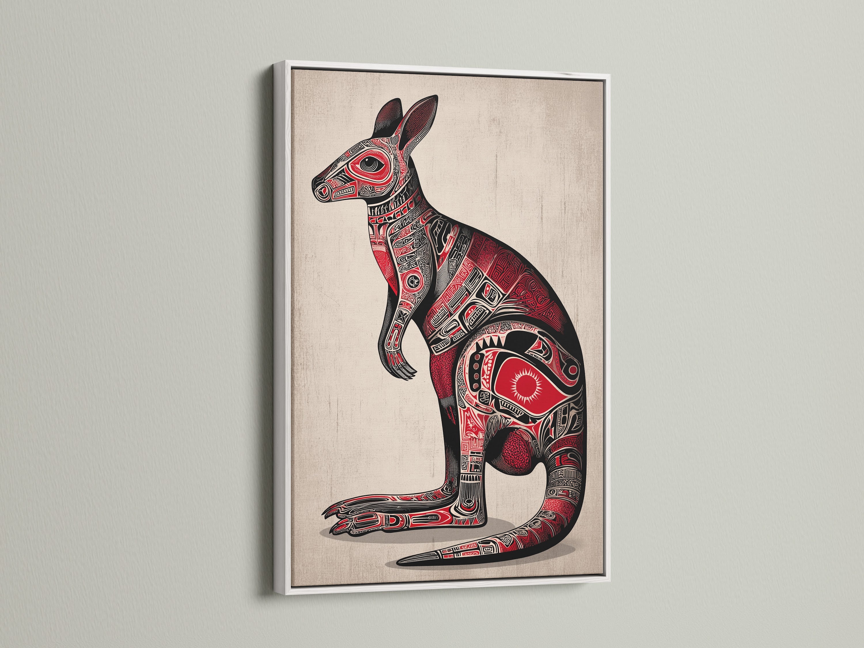Aboriginal Kangaroo art is presented in a white frame. The artwork contrasts beautifully against the frame's clean lines. The kangaroo is depicted with tribal art elements. The red and black colors stand out. Ideal for adding a touch of ethnic wall art.
