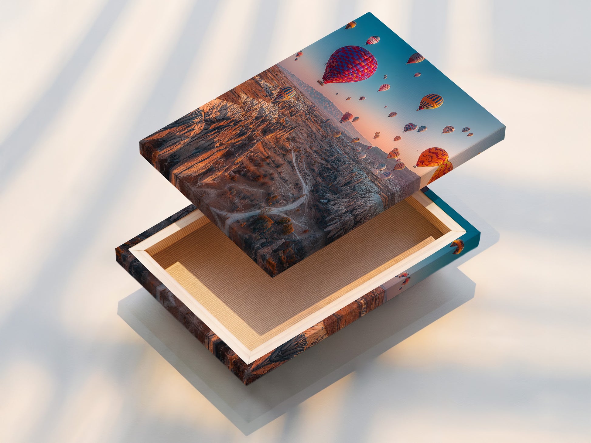 A stretched canvas print of hot air balloons in Cappadocia. The travel wall art is ready to hang. This landscape canvas brings adventure into your home. Perfect for living room wall art and bedroom wall decor.