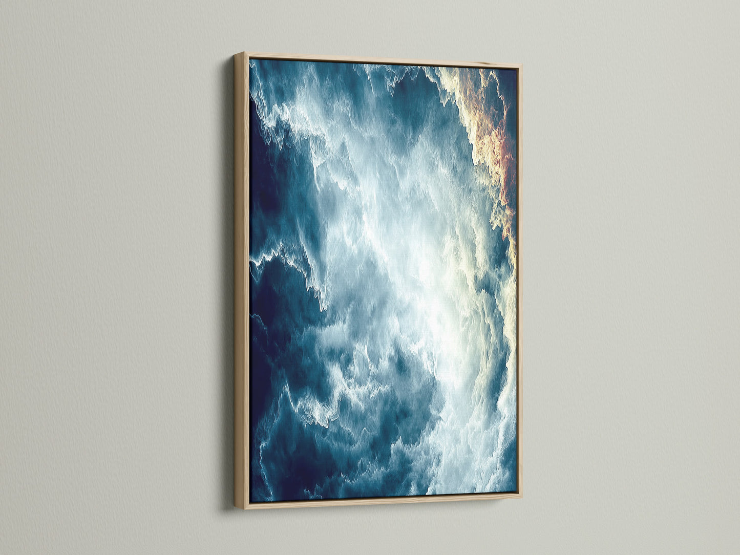 This is a modern abstract cloudscape canvas print. The artwork features a teal blue sky. It is framed in a natural oak. Enhance your space with this serene cloudscape art. The oak frame adds a touch of warmth.