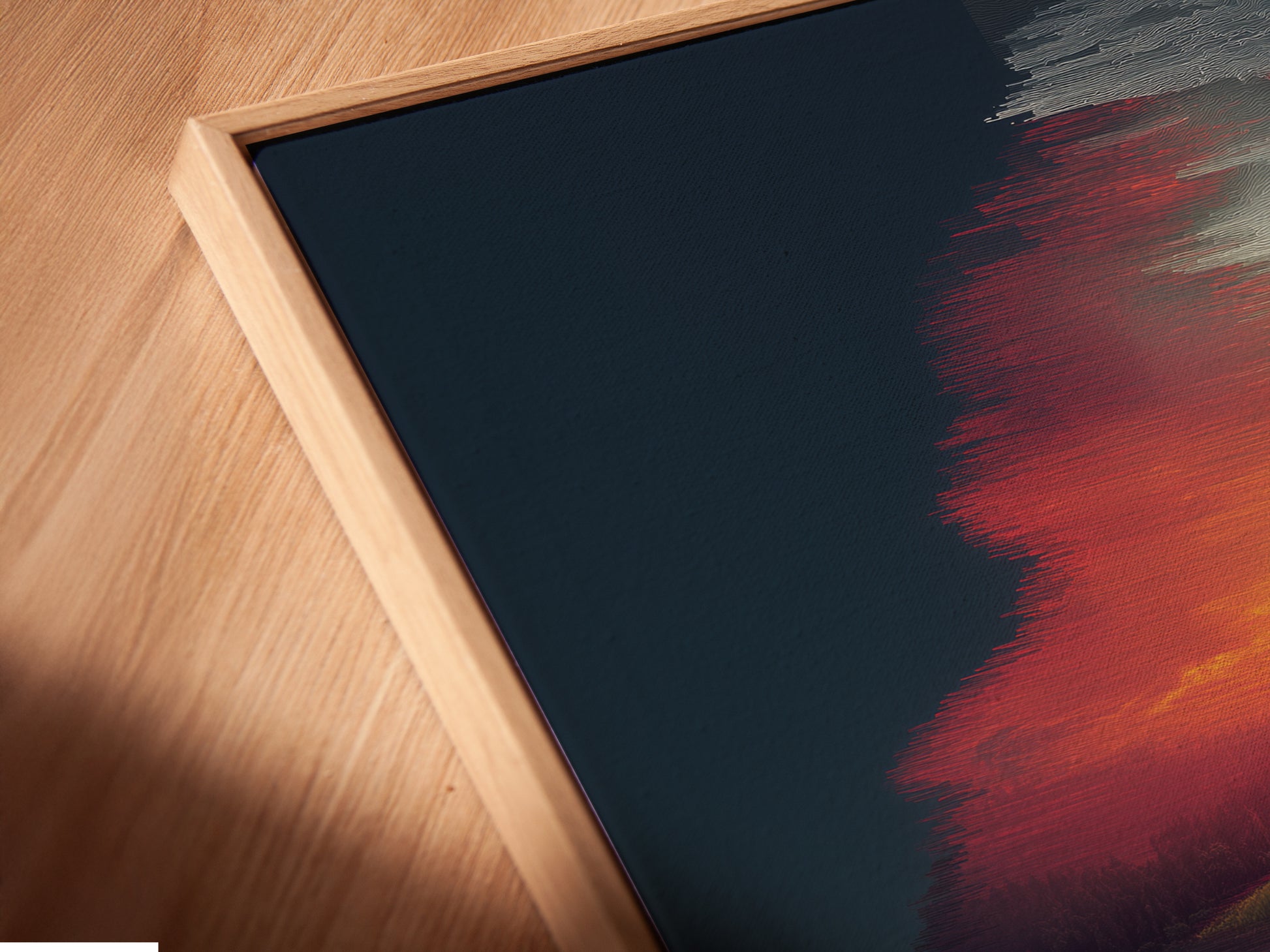A close-up angled view shows a canvas print in a floating frame. The artwork features a surreal landscape with a sunset reflection. This modern wall decor adds depth and dimension to any space. Ideal for living rooms bedrooms offices studios lobbies and clinics