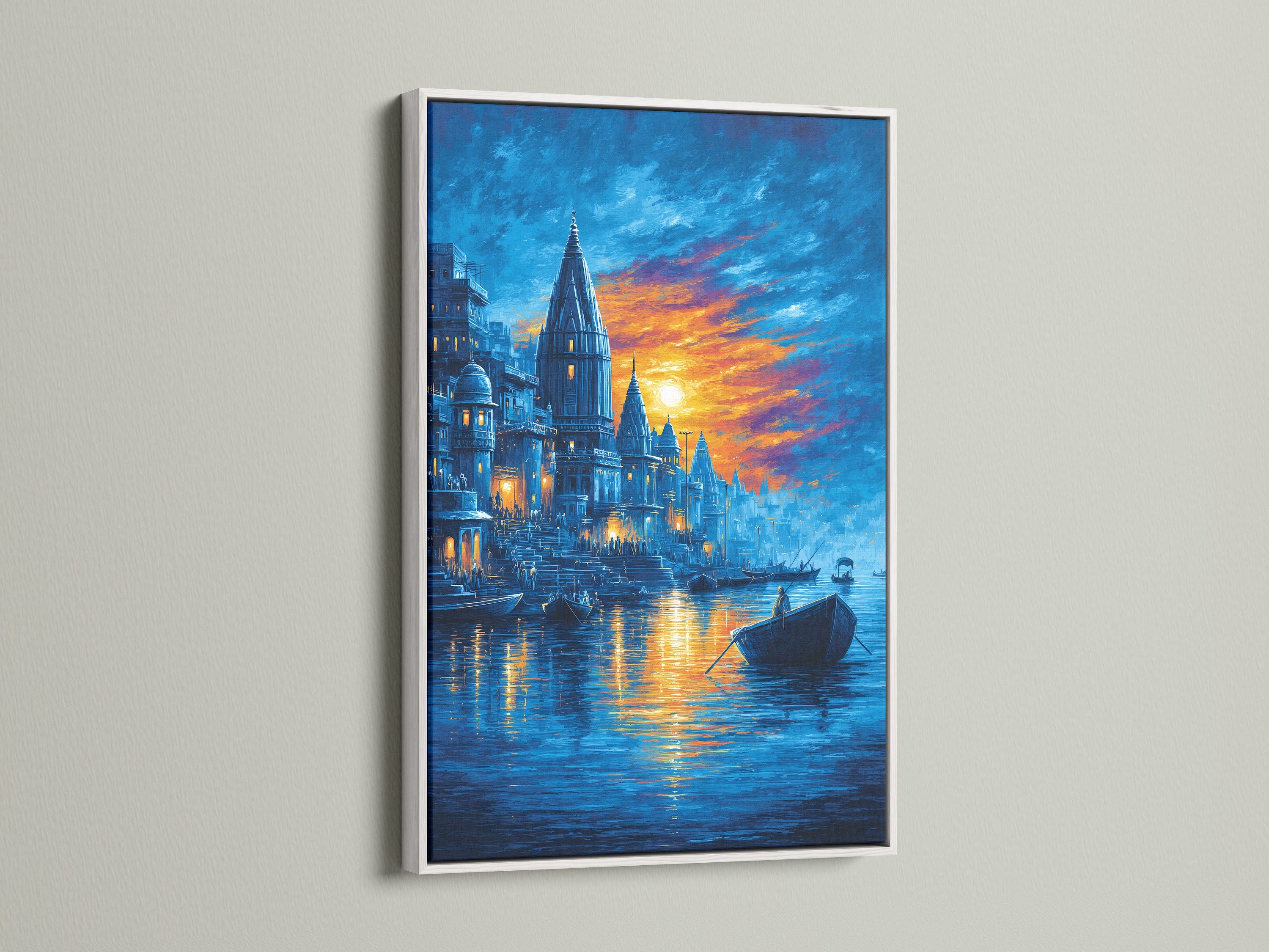 Varanasi Sunset Wall Artwork is beautifully presented in a white frame. This sacred river print brings a calming presence to any room. The blue and orange tones of the Indian temple art create a peaceful atmosphere. Perfect for yoga studios or as spiritual wall art. It enhances bohemian and minimalist styles.