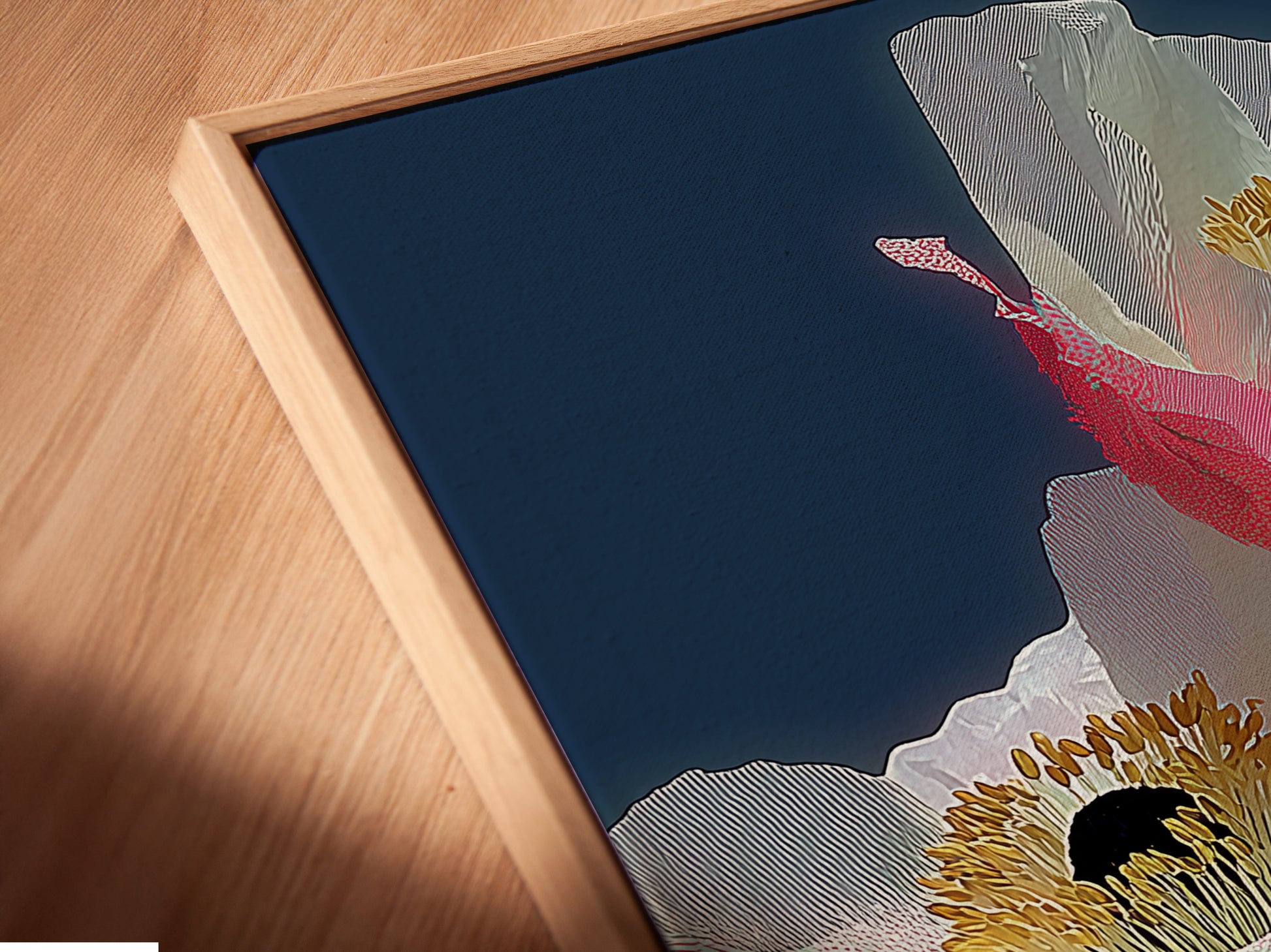A close-up angle shows a canvas print in a floating frame. The pink poppy art is modern floral wall art. It is a contemporary botanical artwork. This piece is perfect for adding elegance to any space. It is a beautiful botanical artwork.