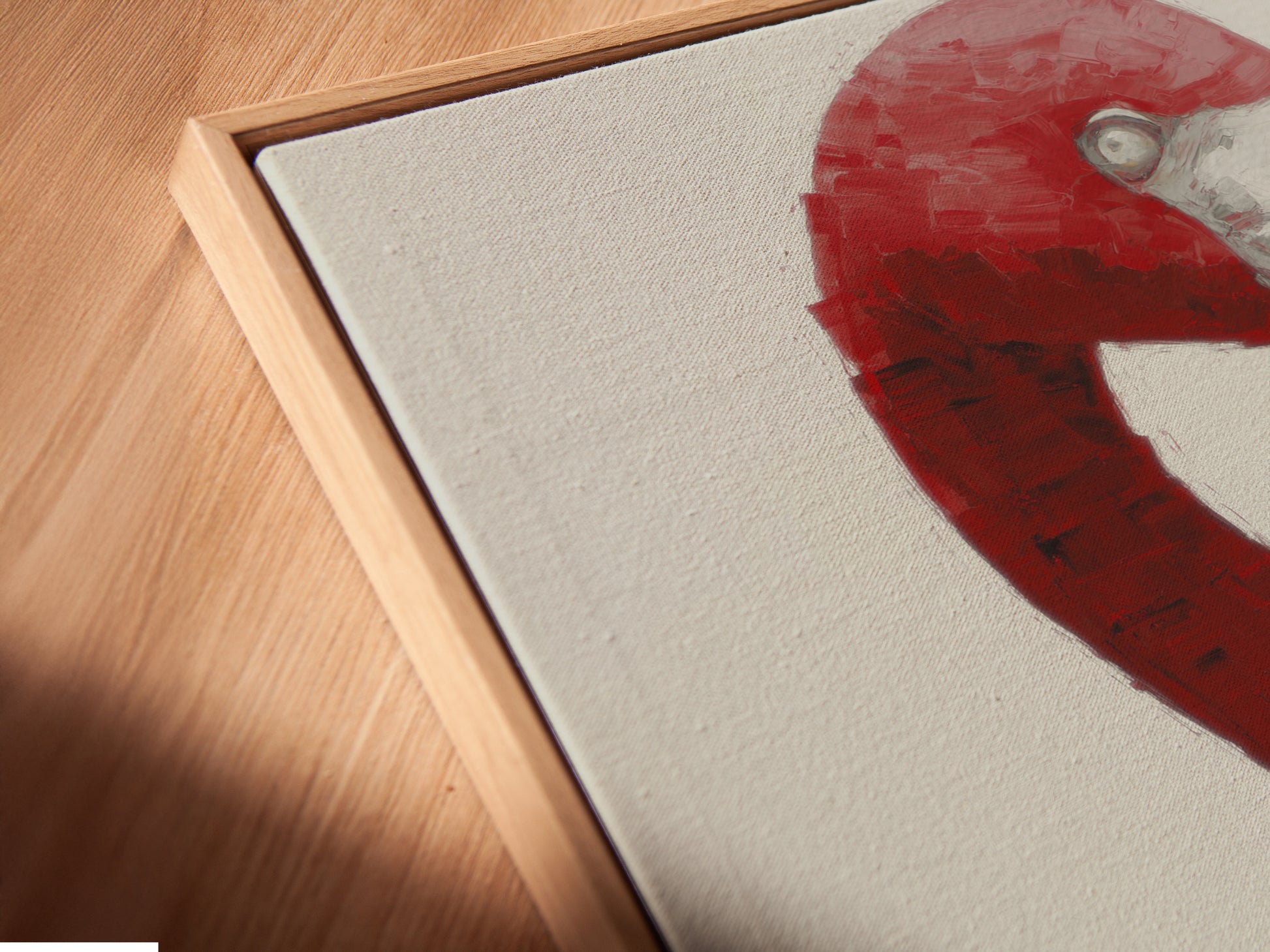 Angled close-up of a canvas print in a floating frame. The pink flamingo wine art print is a modern piece. This whimsical animal artwork enhances any space. Shop now for unique floating frame options.