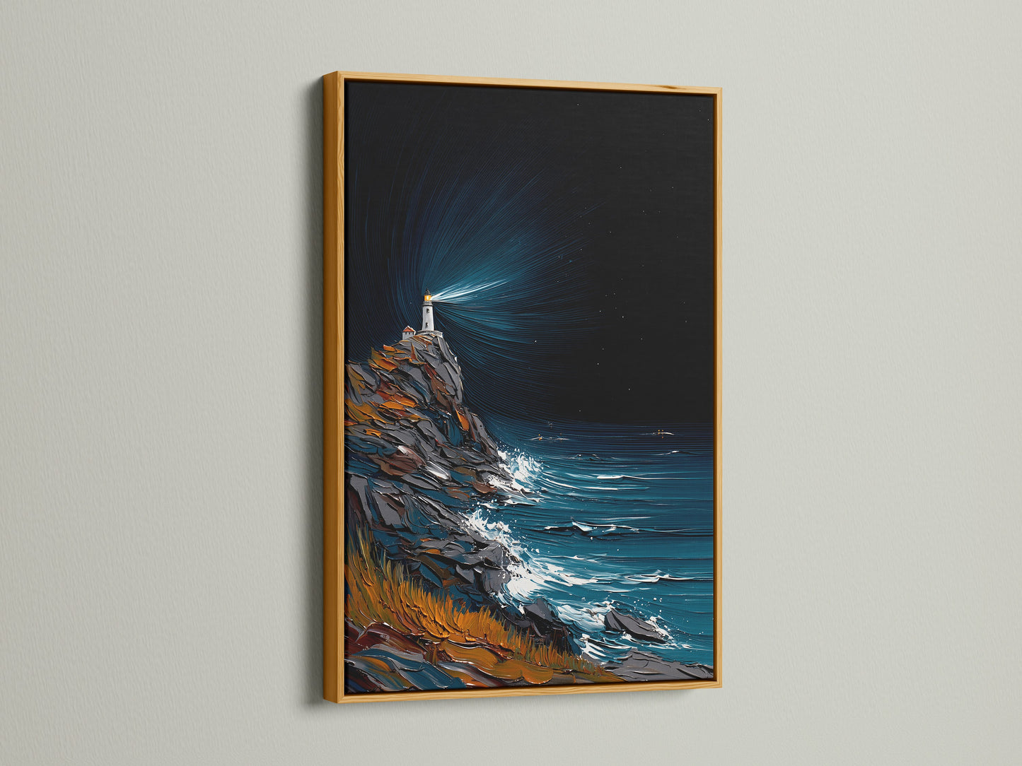 Lighthouse coastal artwork displayed in a gold frame. The gold frame brings a touch of elegance to the ocean wave art. Nautical decor suitable for various interior styles. Perfect for lake houses and foyers.