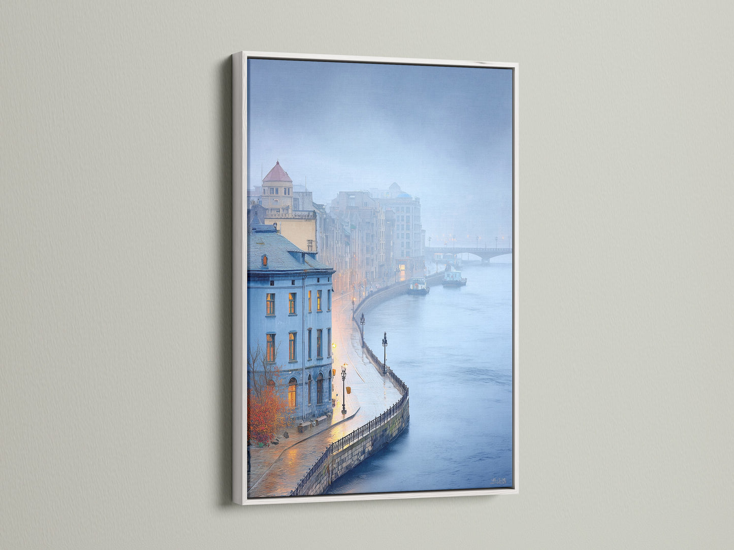 A white frame beautifully displays a cityscape art print. The artwork shows a vintage European city. The blue hour lighting adds a calming touch. Enhance your office wall art with this piece.