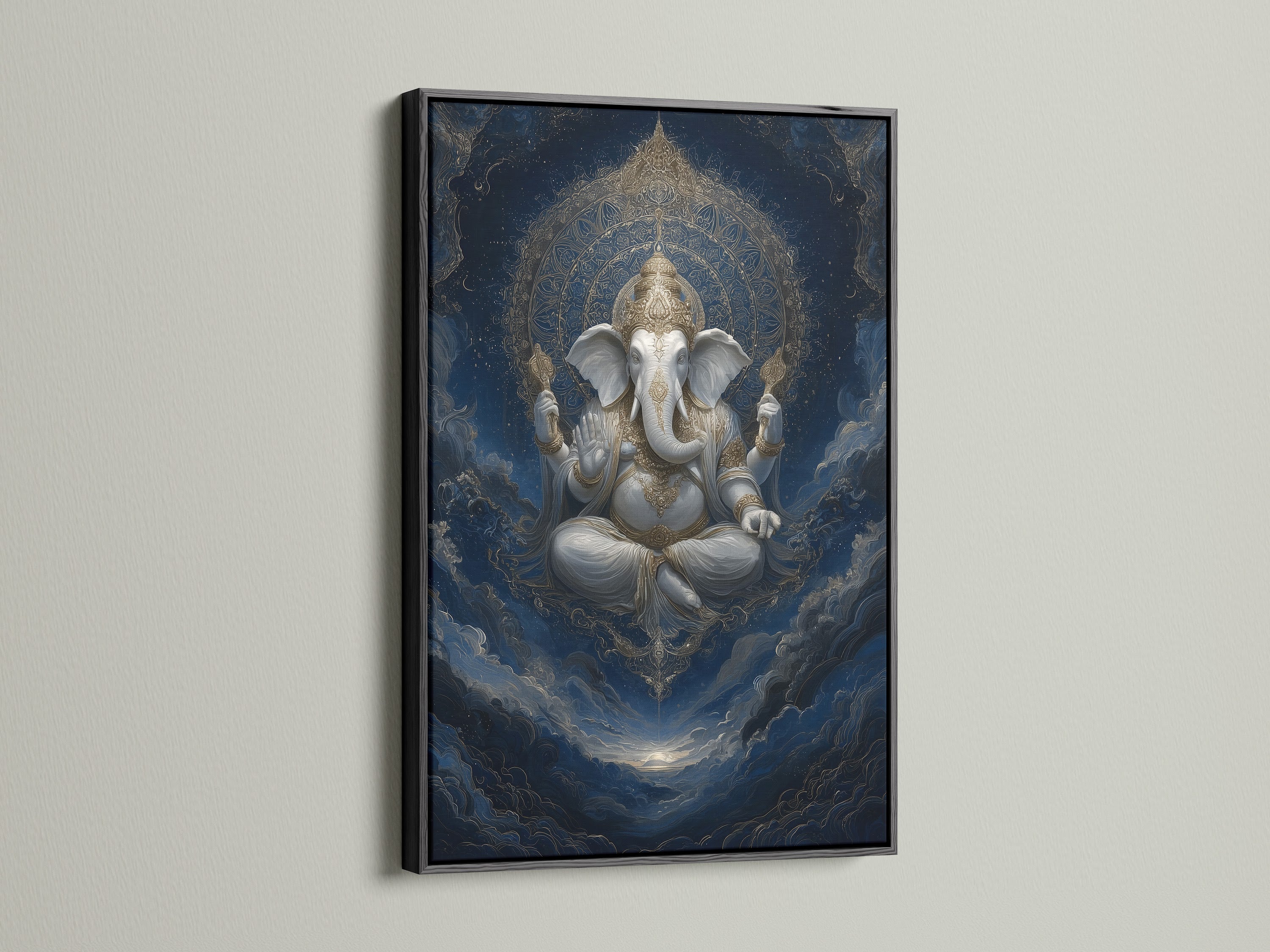 Ganesha Canvas Print in a black frame. This deity wall art is perfect for creating a meditation space. The religious art adds a touch of elegance to any room. This Hindu home decor is both eclectic and spiritual.