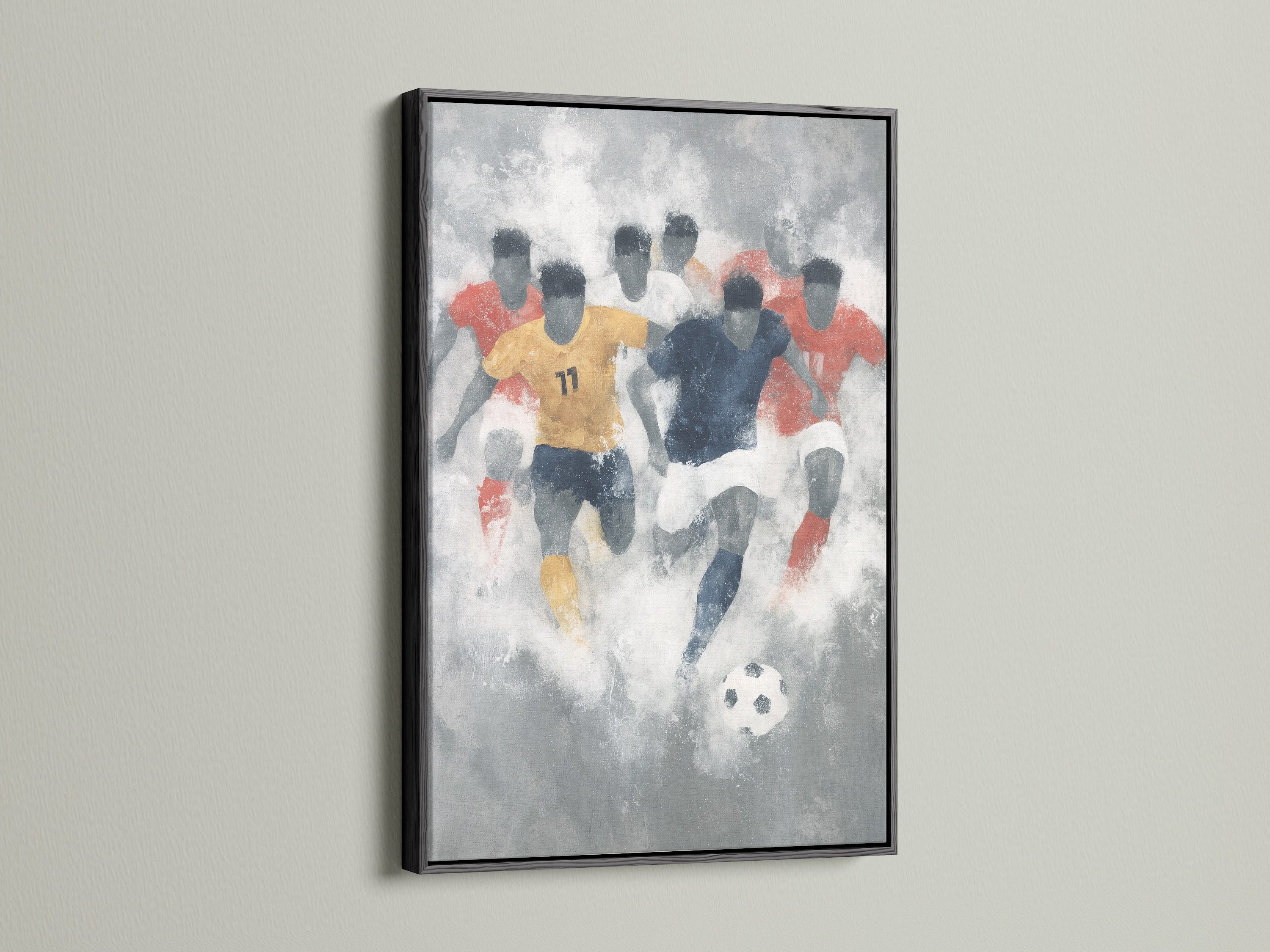 Abstract sports art framed in a sleek black frame. The artwork features a dynamic scene of soccer players. The black frame provides a modern contrast to the watercolor soccer art. This sports wall decor is a great choice for a teen boy bedroom decor.