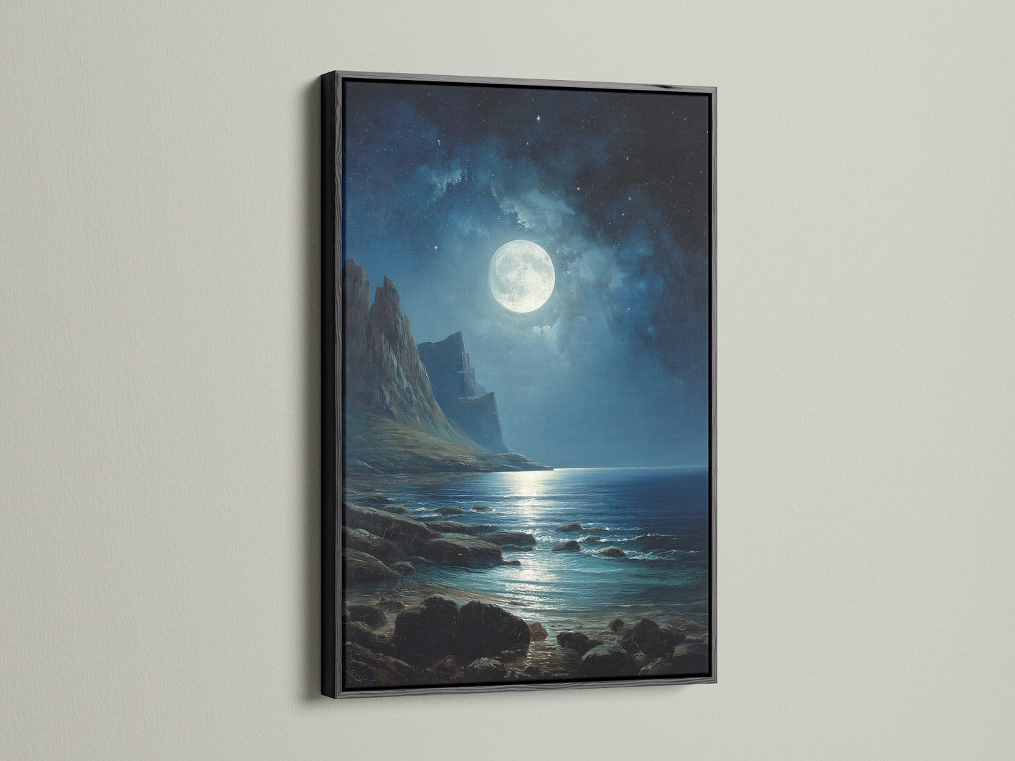 The featured artwork is a moonlit ocean scene set in a sleek black frame. The dark frame enhances the dramatic feel of the night time landscape. This framed artwork adds a touch of sophistication to any room. It's a timeless choice for modern and classic interiors.