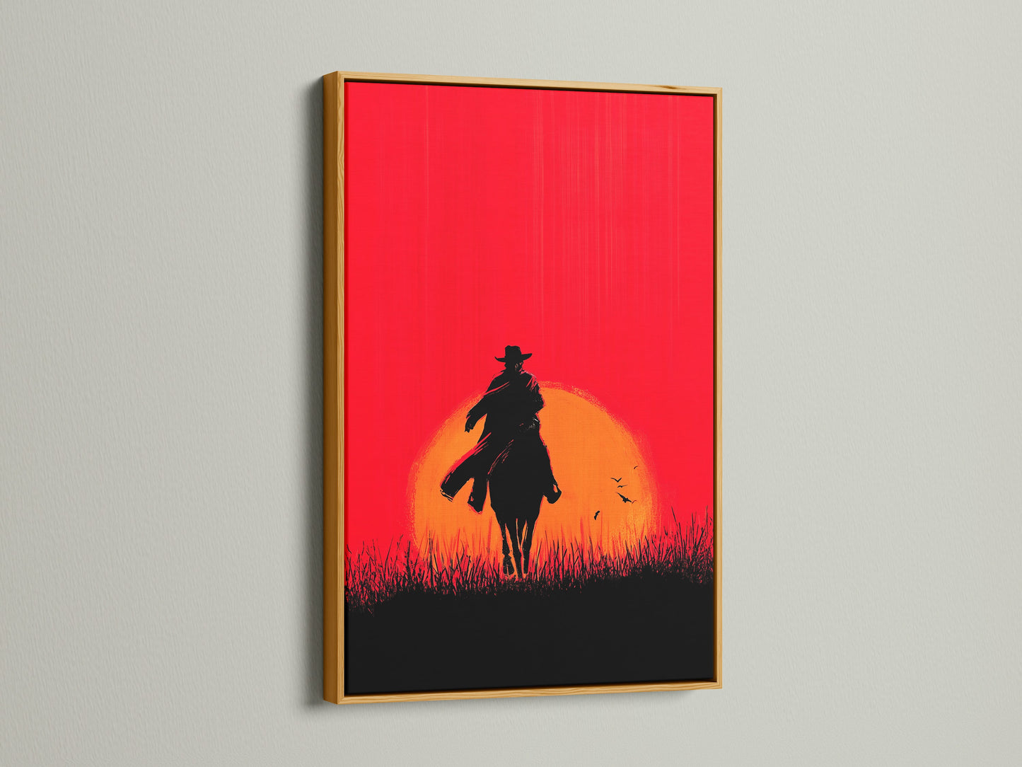 Cowboy Sunset Canvas Print with gold frame. The red orange silhouette of a horse rider adds a touch of western flair. This artwork is perfect for man caves offices or any space needing rustic wall decor. This is a stunning sunset wall art piece.