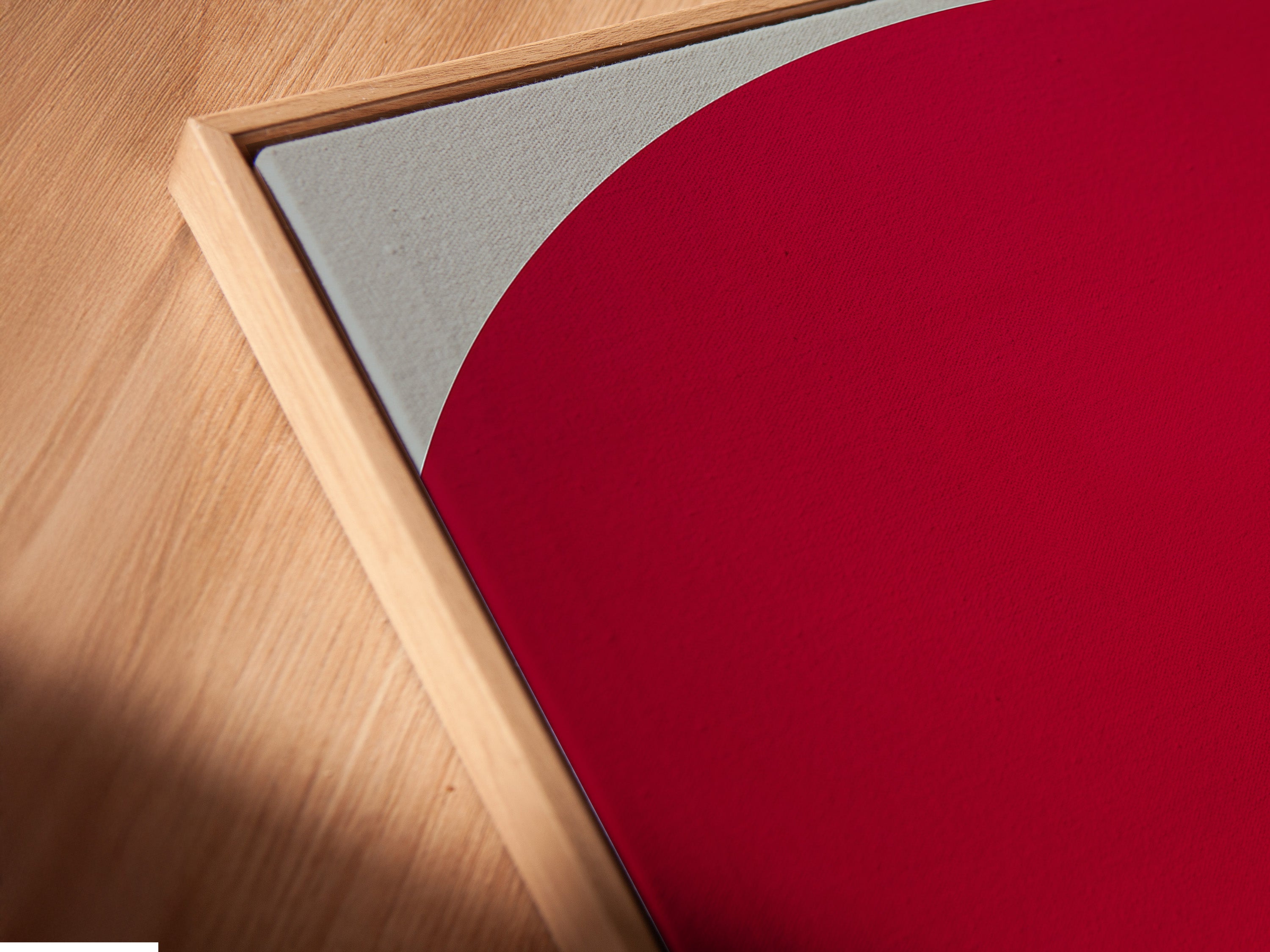 A close-up angled view of a fashion canvas print in a floating frame. The pop art features a woman in a white outfit against a red backdrop. The floating frame adds depth. It is perfect for modern wall decor in bedrooms or living rooms.