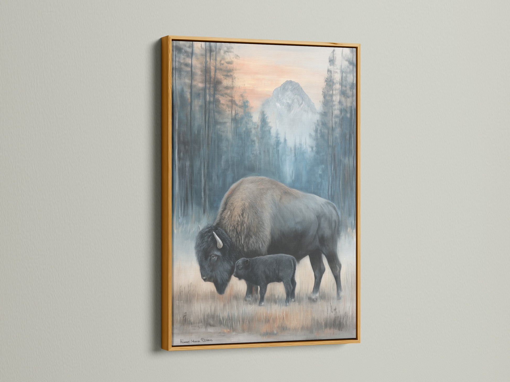This bison art is showcased in a gold frame. The artwork depicts a mother and calf. Add a touch of elegance with this wildlife canvas. Ideal for rustic decor and animal wall art collectors.