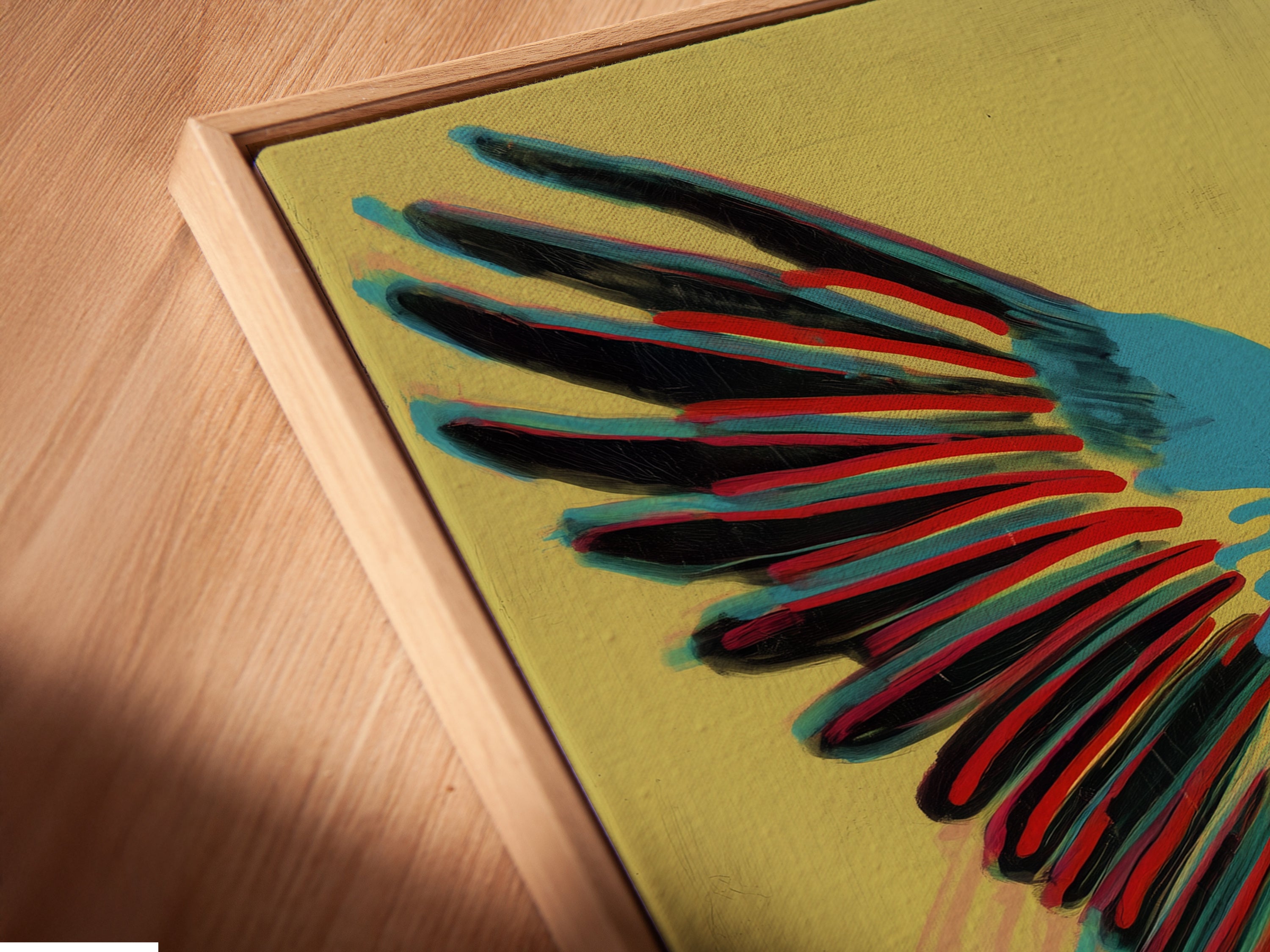 A close up angled shot of the canvas print in a floating frame. This floating frame style enhances the artwork. The colorful parrot and retro turntable are beautifully displayed. See the details of this framing.