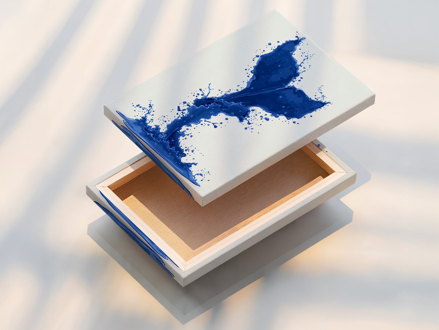 A beautifully stretched canvas print is displayed. The cobalt blue whale tail artwork is ready to hang. This offers a clean modern look. It is ideal for adding coastal artwork to your home decor.