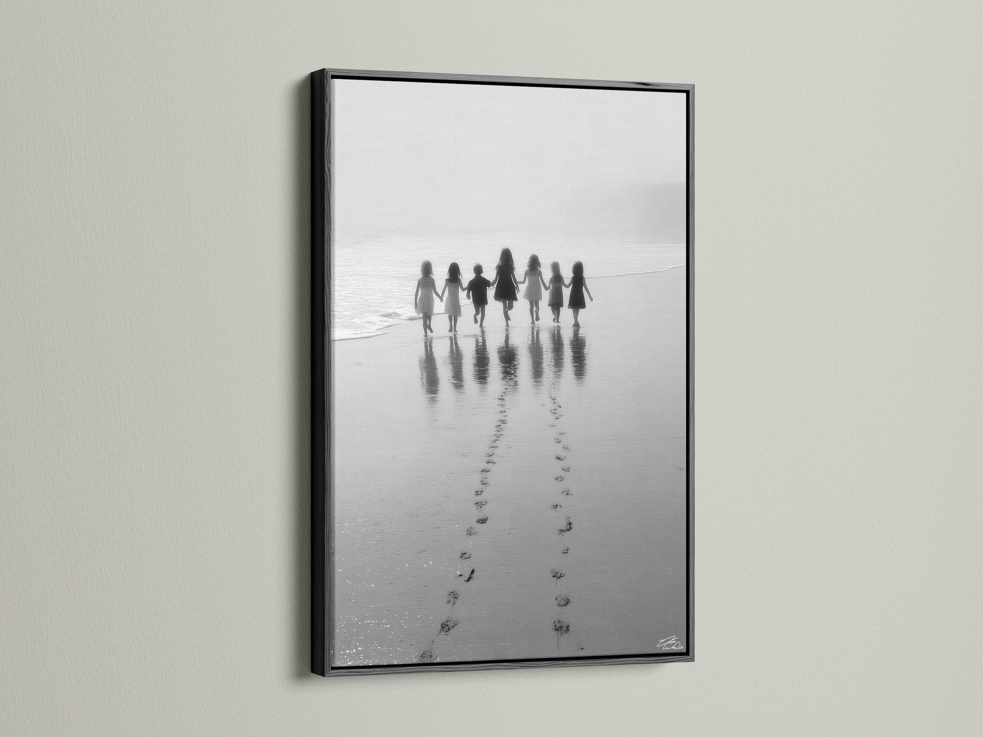 The Beach Walk canvas art is striking in a black frame. This black and white seascape photo adds elegance. Its perfect for nursery decor or any space needing minimalist art. The children print is a timeless family photo. Shop now.