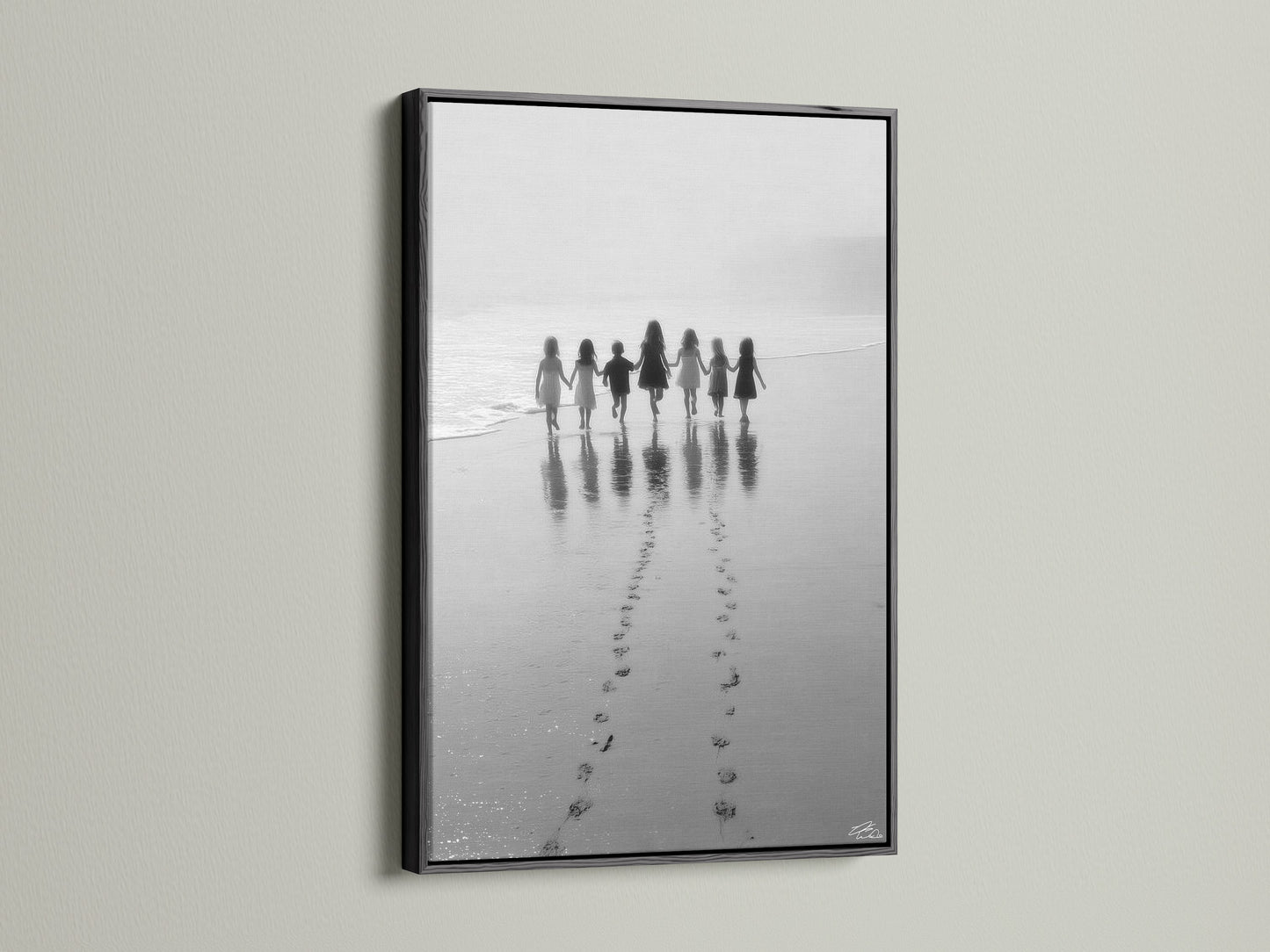 The Beach Walk canvas art is striking in a black frame. This black and white seascape photo adds elegance. Its perfect for nursery decor or any space needing minimalist art. The children print is a timeless family photo. Shop now.