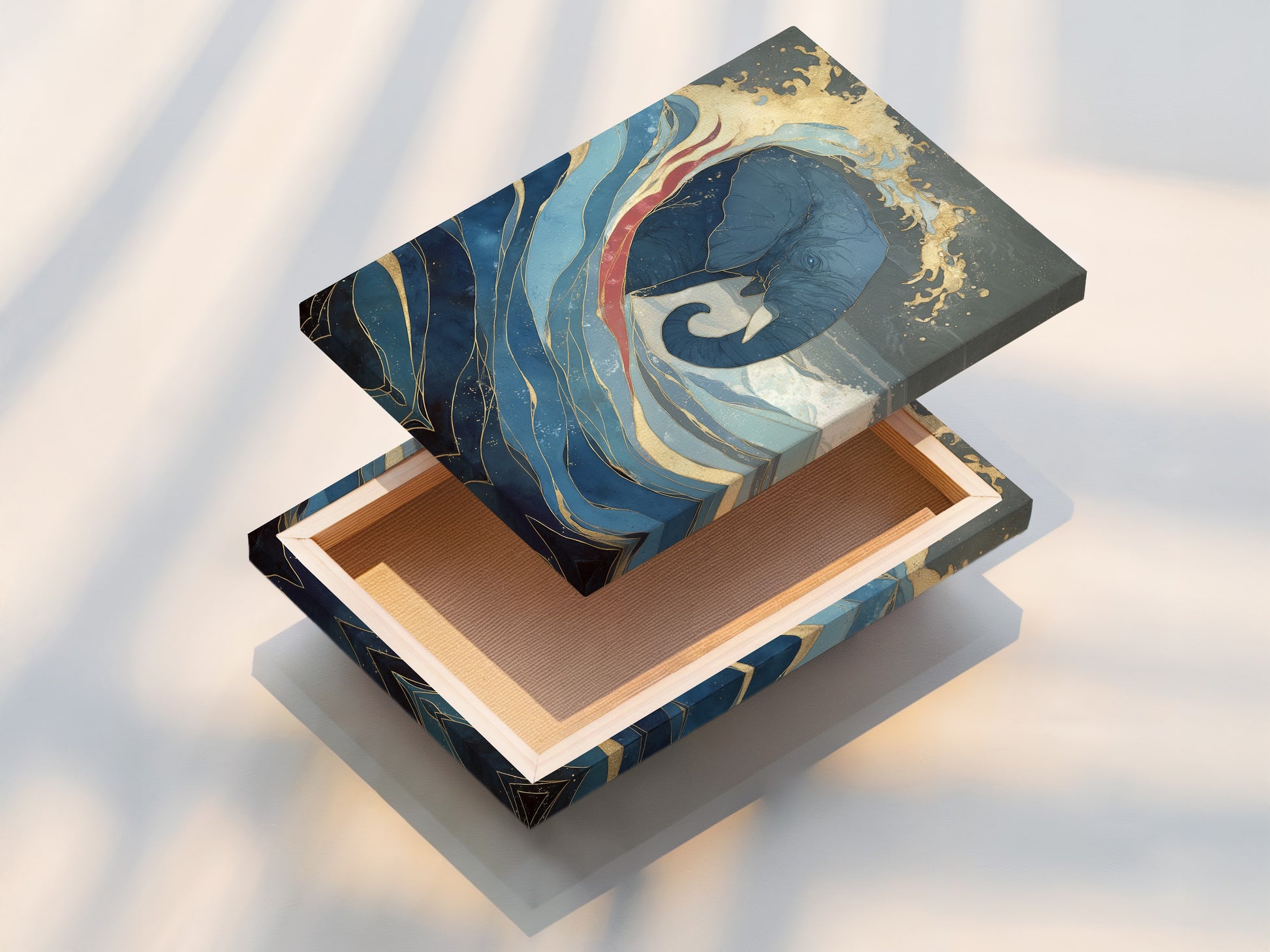 Close-up view of a stretched canvas print showcasing the elephant and ocean wave artwork. This blue and gold abstract artwork is stretched over a wooden frame. Ready to hang and enjoy in your living room bedroom or office space.