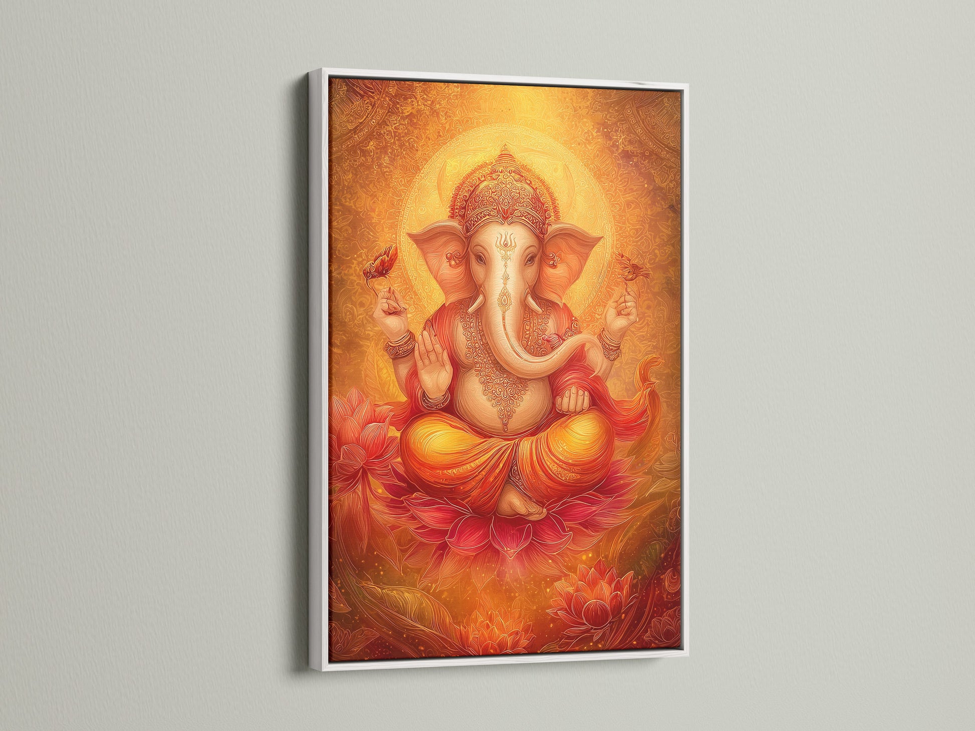 Ganesha Canvas Art in a white frame. The Hindu God is depicted in golden orange spiritual art. It is ideal for meditation room decor. This artwork enhances yoga studios. The art complements bohemian eclectic and modern spaces.