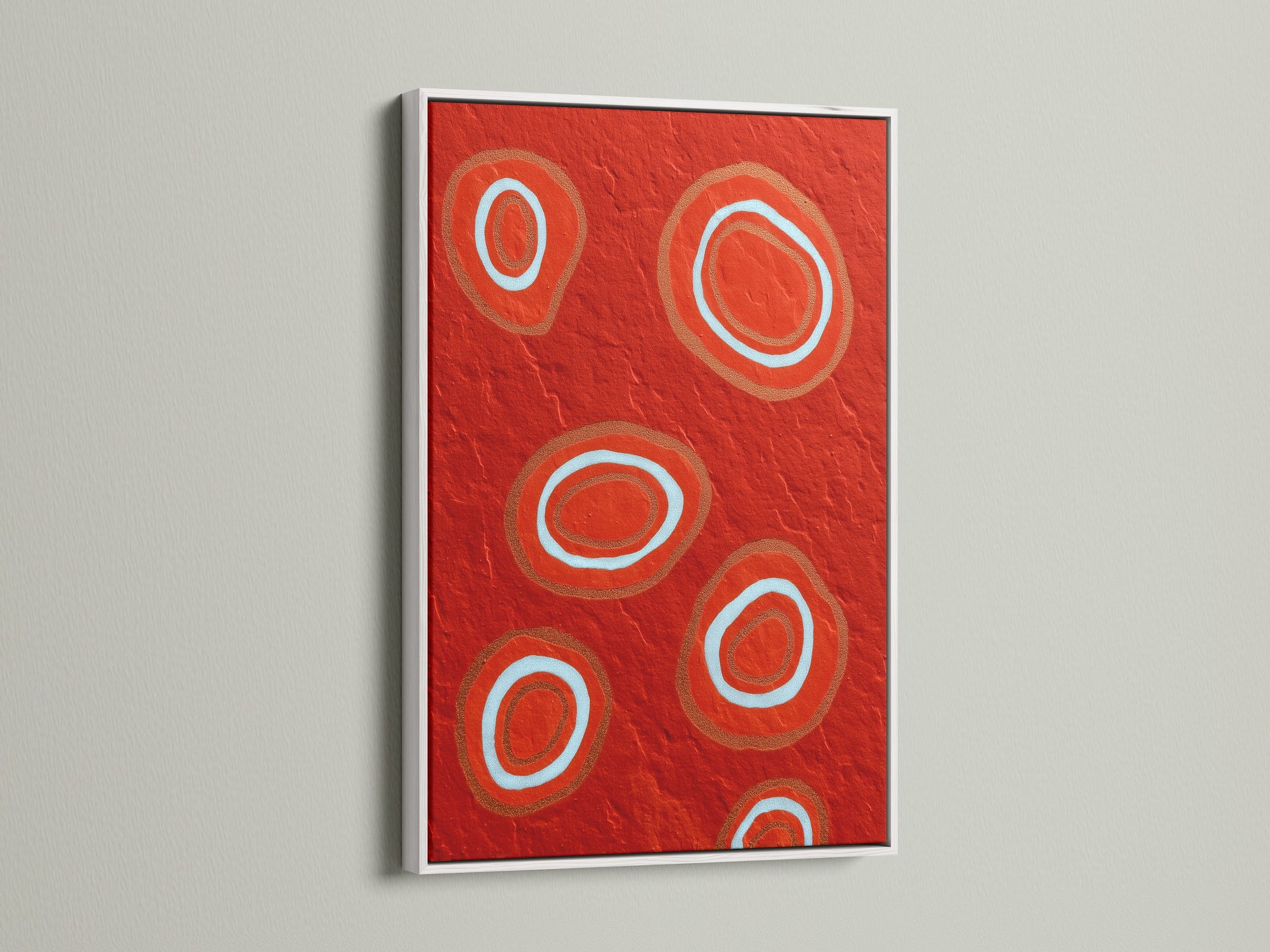 The white frame highlights the striking abstract red artwork. This geometric canvas print brings a modern touch to any room. The bold circle art stands out against the clean white frame. Perfect for a contemporary space seeking vibrant wall decor. A stylish choice for modern art enthusiasts.
