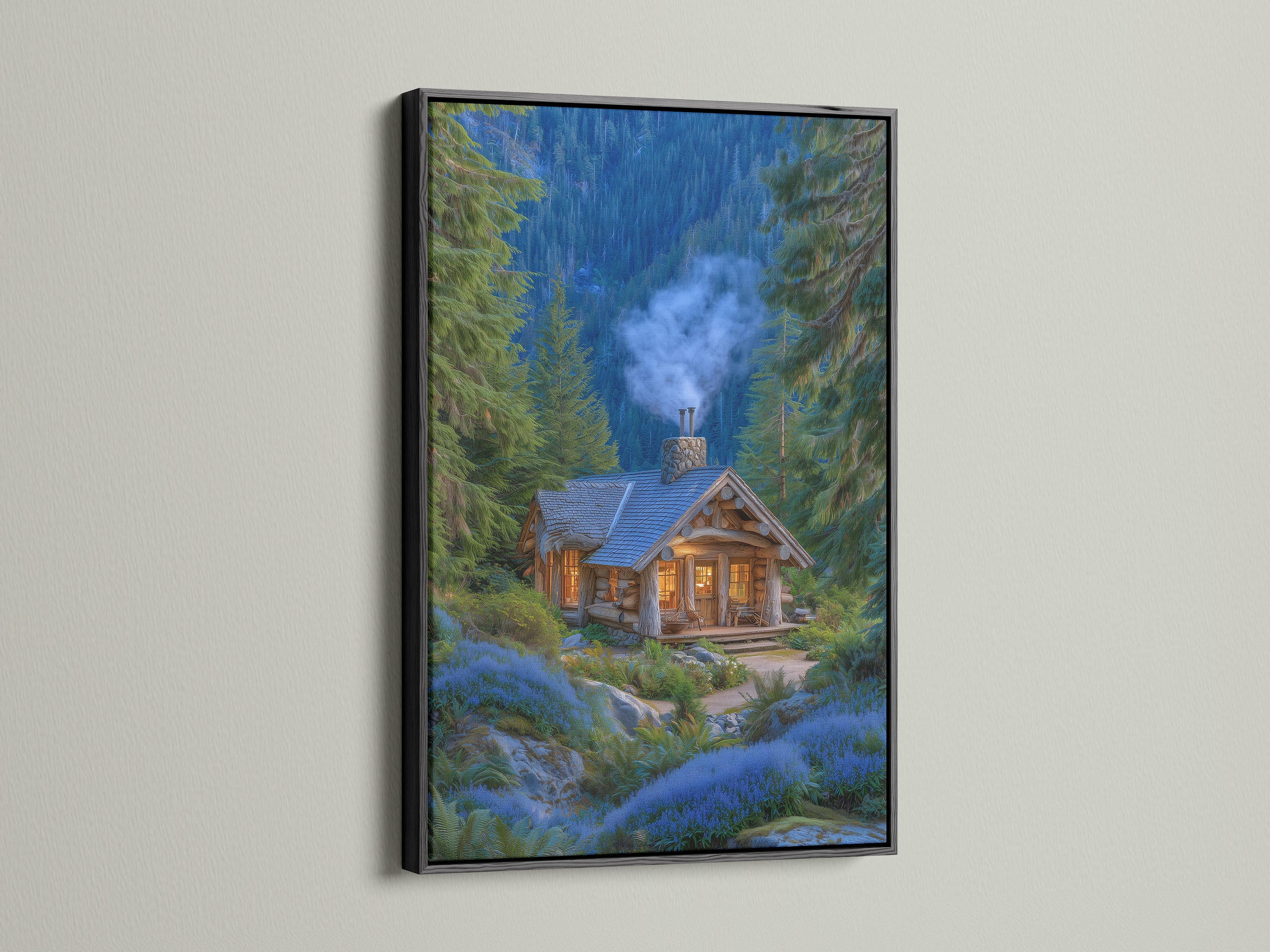 A framed forest cabin artwork with a black frame is displayed. The artwork features a cozy mountain lodge nestled among pine trees and blue flowers. This rustic woodland cottage art brings nature indoors. The black frame creates a bold and striking contrast enhancing the artwork.