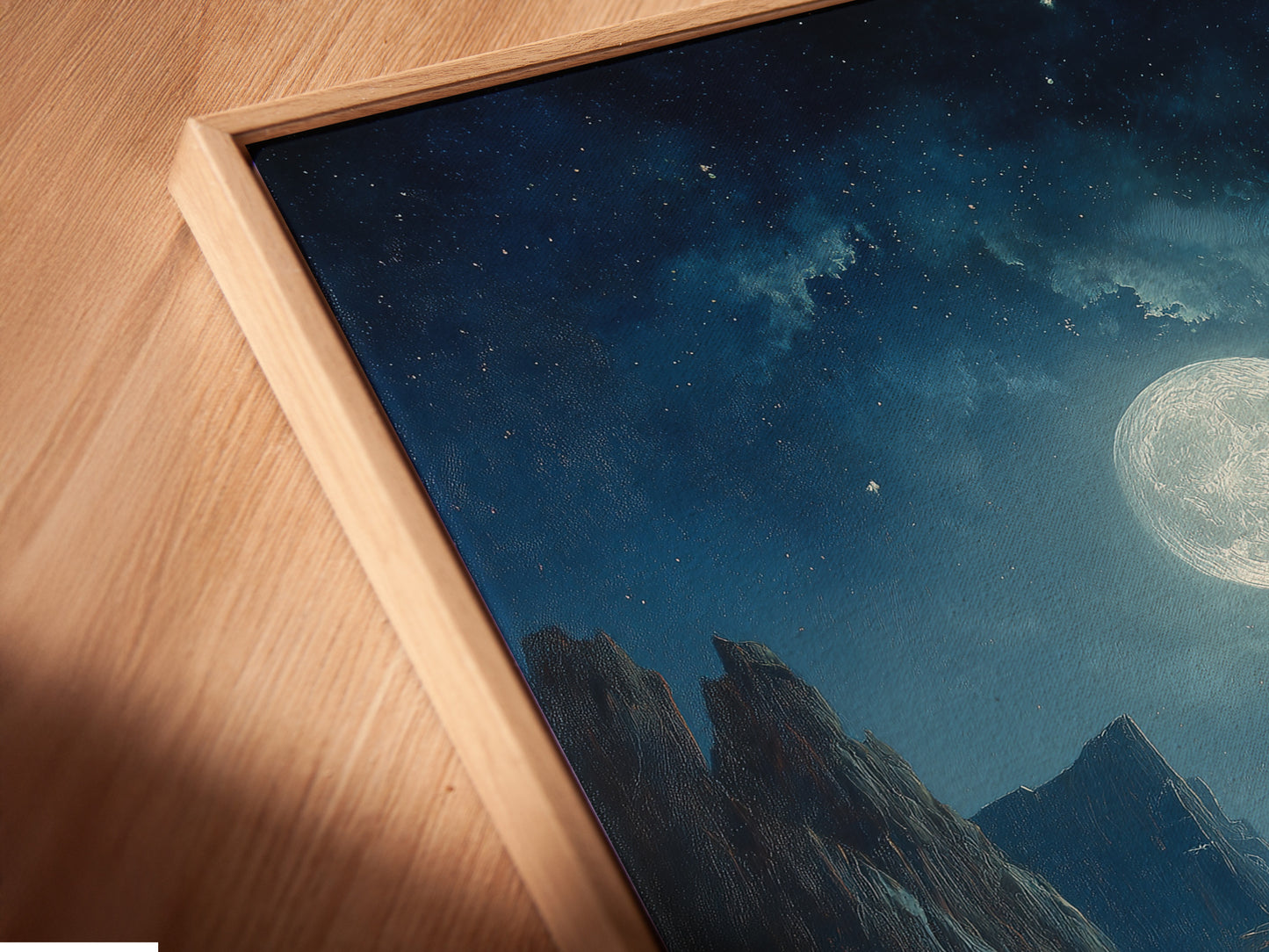 An angled close up view reveals a canvas print in a floating frame. The artwork features a captivating moonlit seascape. The floating frame adds depth and dimension to the artwork. This framed piece enhances the artwork's visual impact. It creates a gallery like display in your home.