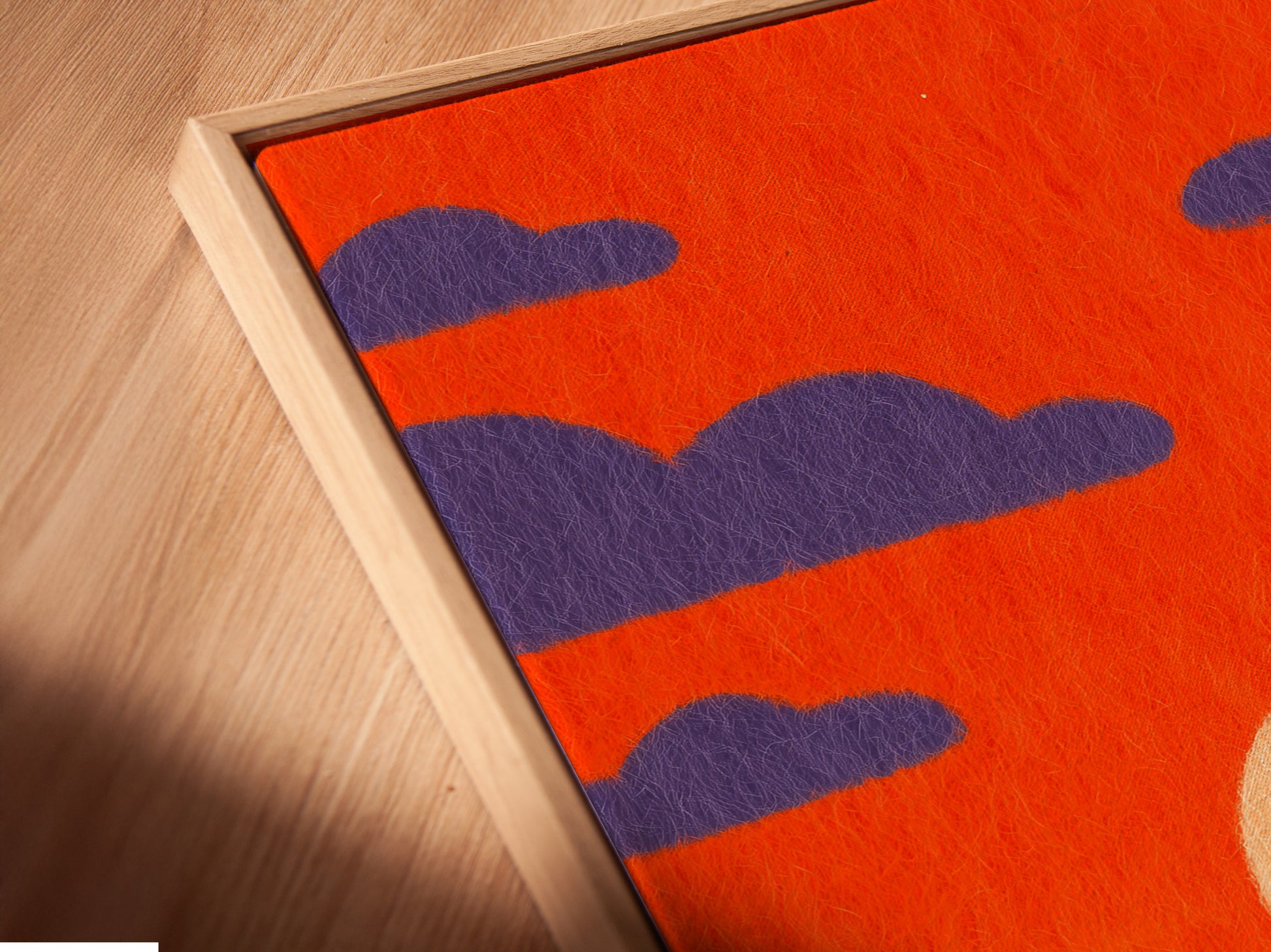 A close-up of a canvas print in a floating frame. The Sunset Boat artwork showcases a vibrant orange sky. The floating frame enhances its contemporary appeal. A stylish addition to any modern home. Get yours today.