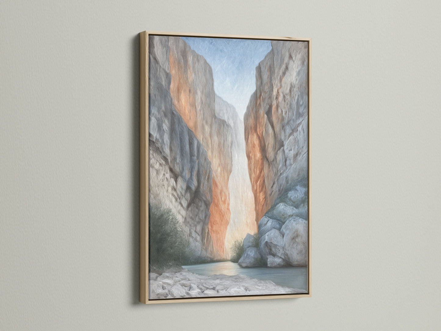 Elevate your space with this canyon wall art in an oak frame. The neutral tone landscape canvas complements minimalist and Scandinavian styles. Ideal living room wall art. A river gorge print brings nature indoors.