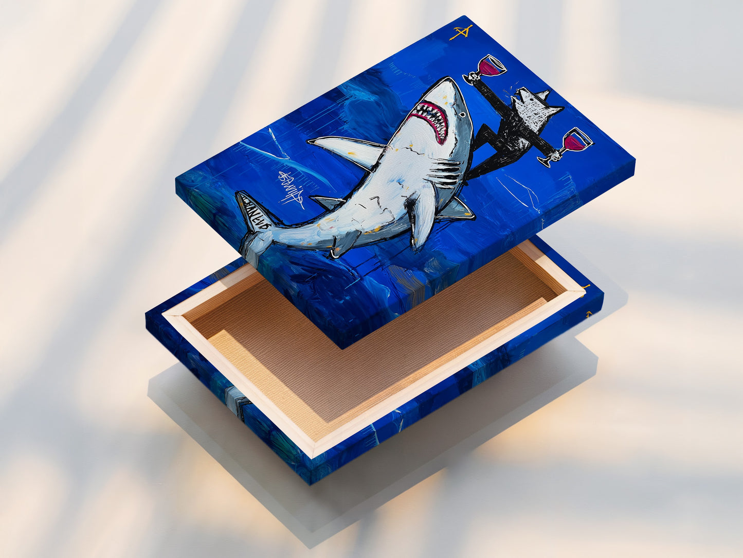 Close up of a stretched canvas print. The shark art pops with bold blue colors. This contemporary piece is ready to hang. No frame needed for this ocean canvas print. Its perfect for adding marine art to your decor.