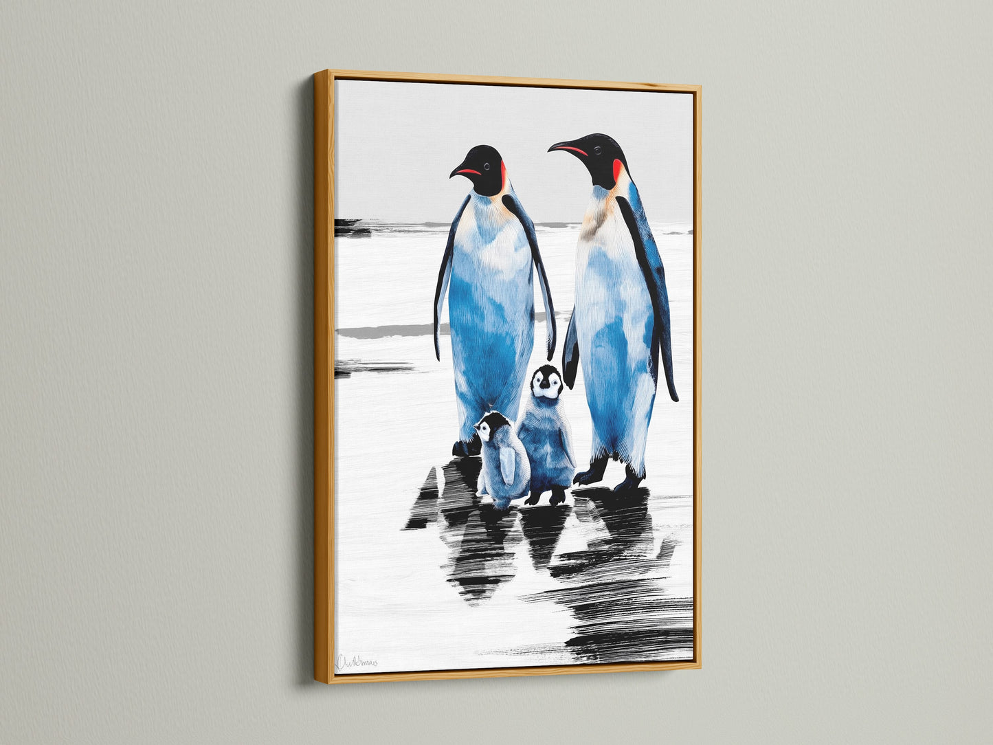 Penguin art print with a gold frame. The arctic canvas creates a coastal atmosphere. It is a perfect piece of animal artwork for blue and white themed rooms. This winter wall art makes a charming animal lover gift.