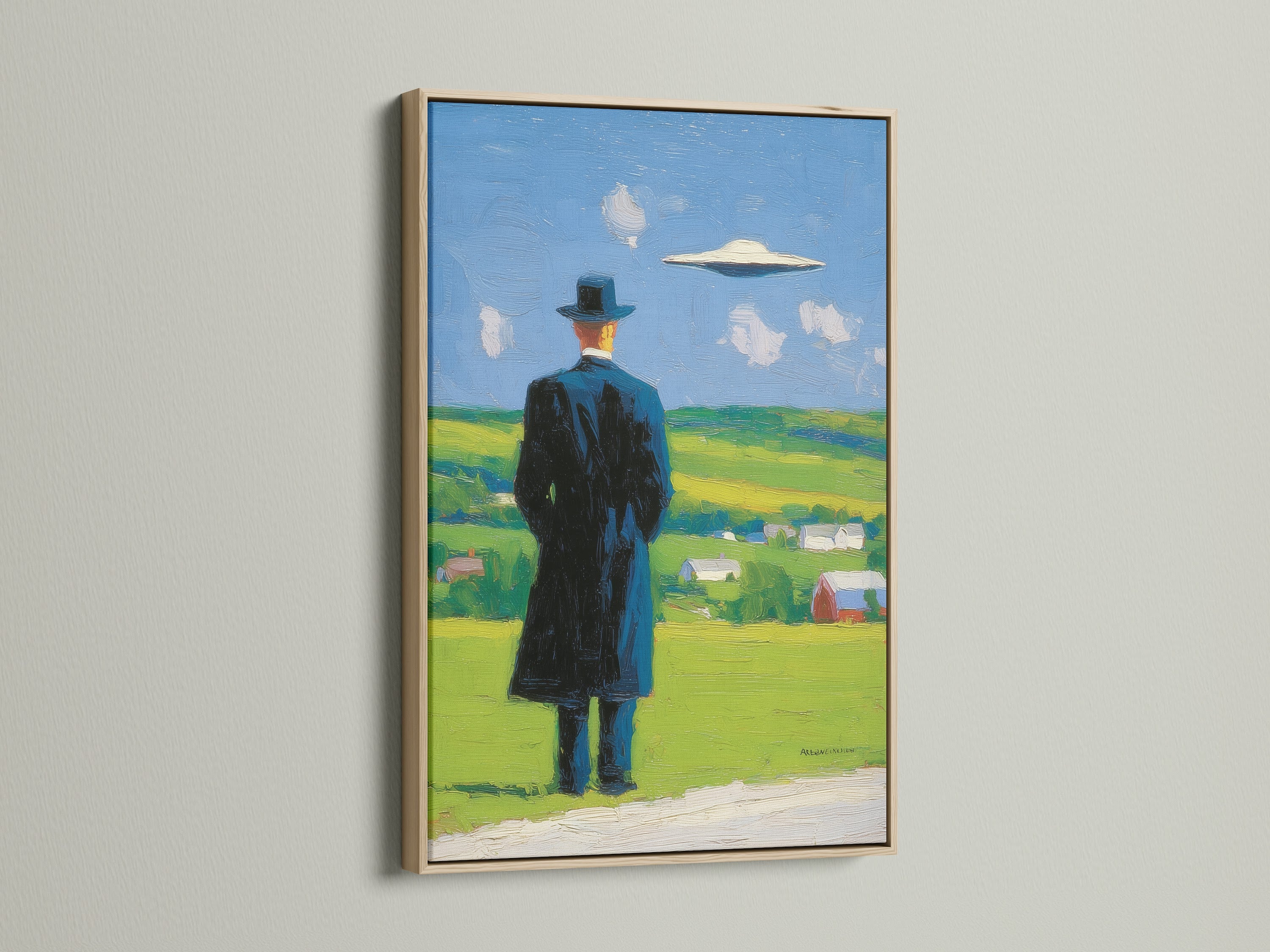 Surreal art print in an oak frame. Mysterious figure looks out onto a landscape with a UFO in the sky. Contemporary art adds a touch of mystery to any room. This piece features primary green and secondary blue colors.