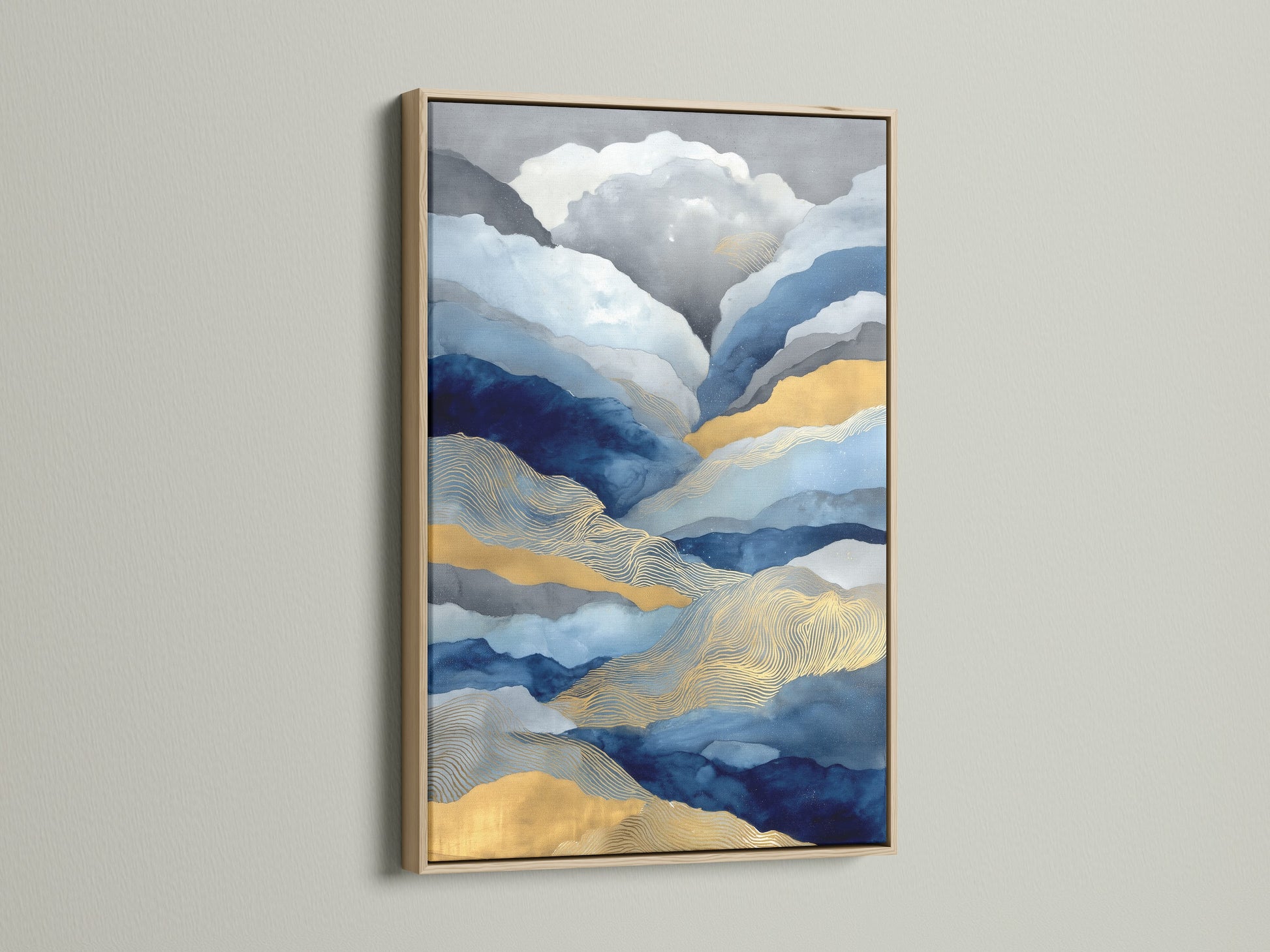 Oak frame displaying an abstract mountain art piece. Blue and gold landscape canvas. Modern nature artwork complements minimalist and Scandinavian styles. Elevate your space with this contemporary print.