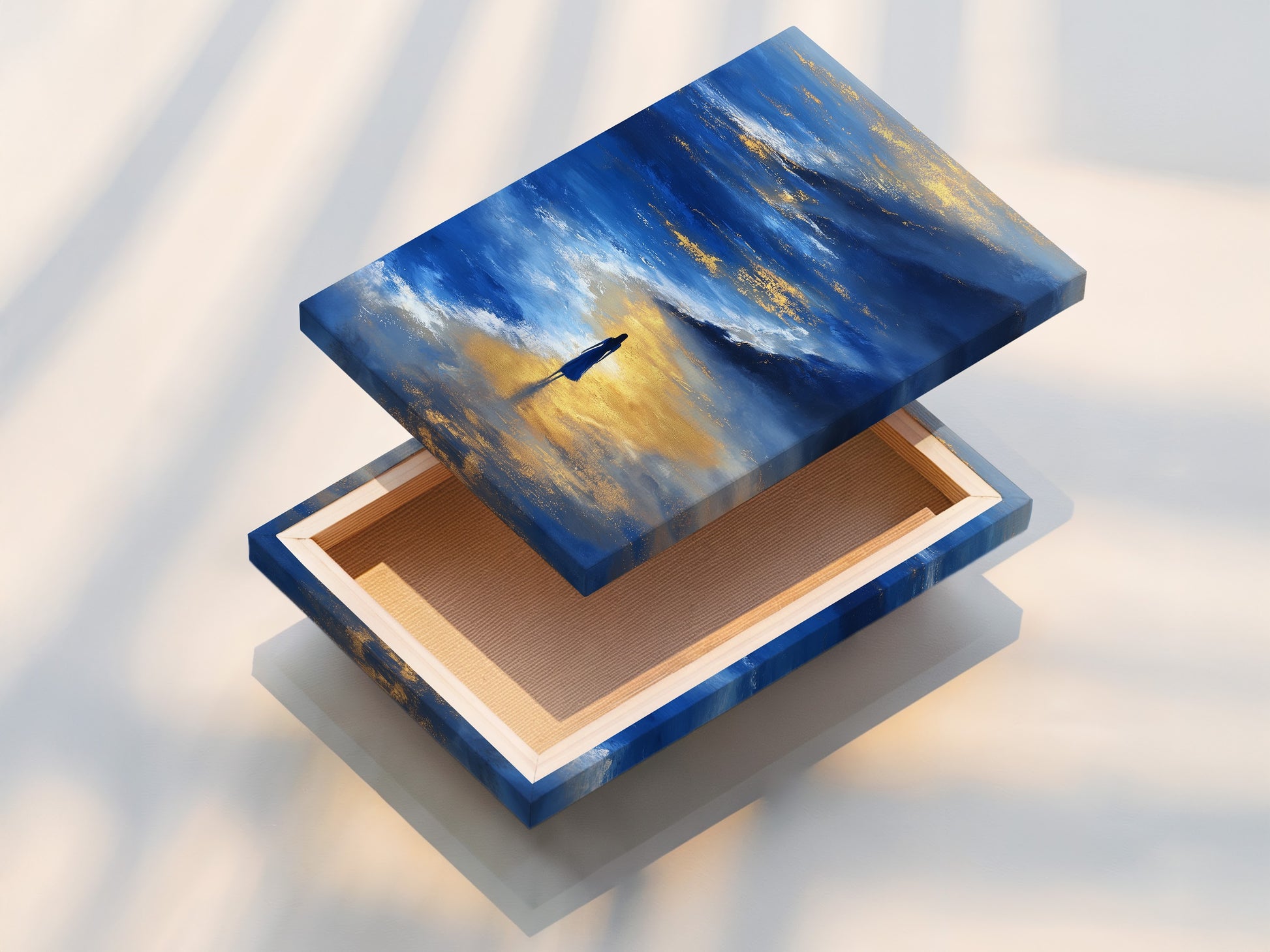 A stretched canvas print of the Ocean Reflection art is displayed. The blue and gold abstract seascape print wraps around the frame. The stretched canvas provides a gallery-quality look and feel. Perfect for adding a serene touch to your walls.
