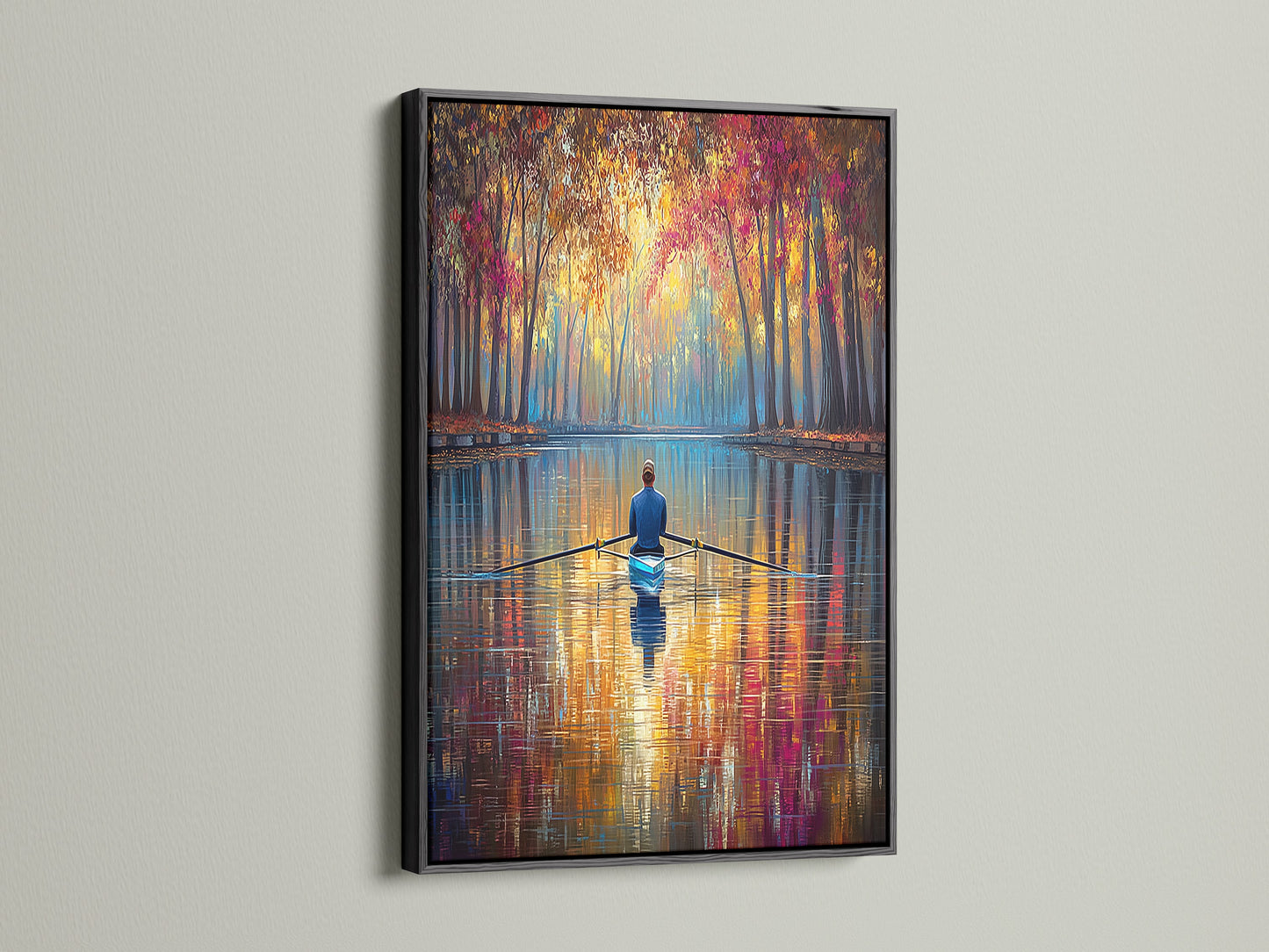 Enhance your home decor with this Rowing Canvas Print in a black frame. The bold black frame accentuates the artwork's vibrant colors. This autumn wall art makes a statement in any space. The tranquil scene brings a sense of calm to your home. A perfect addition for art lovers.