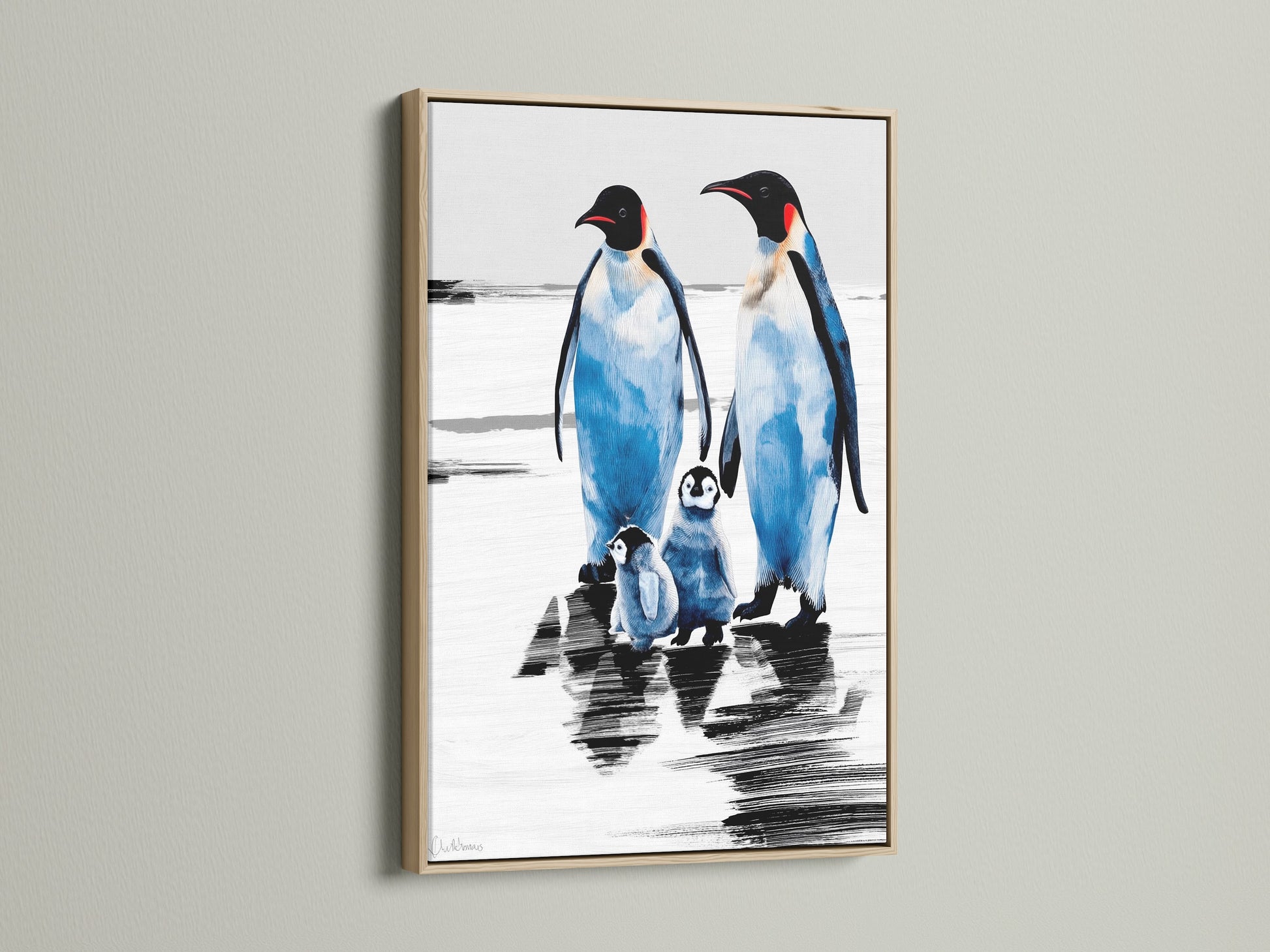 Penguin Family Artwork in an oak frame. The blue and white arctic canvas adds a coastal touch to any room. Ideal wildlife print for nursery wall art or as a gift for animal lovers.