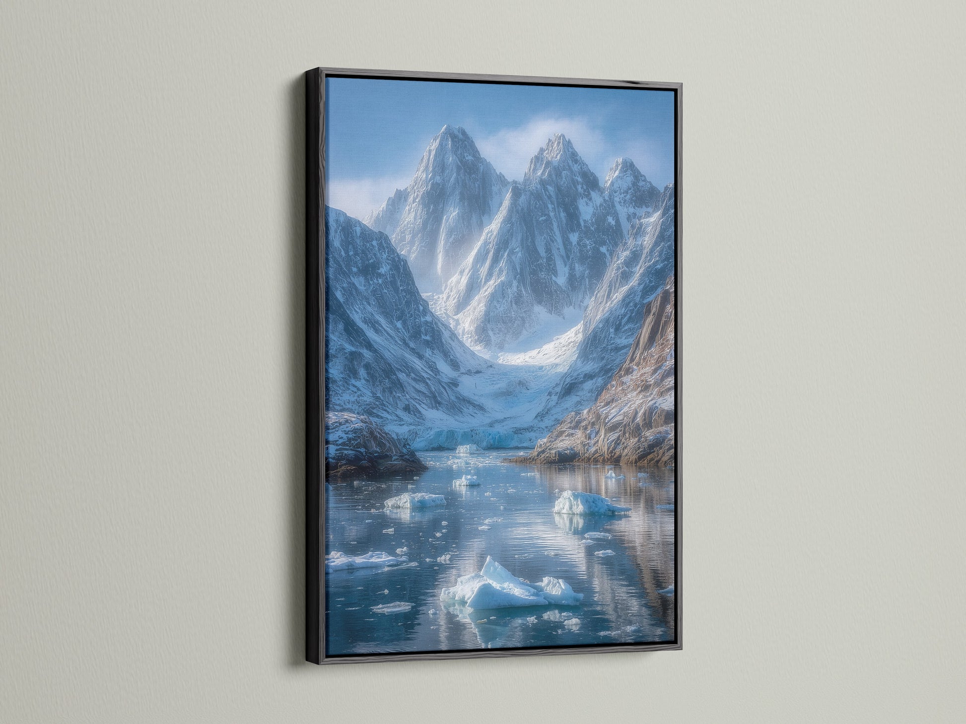 The mountain glacier artwork is presented in a sleek black frame.  The arctic print highlights the beauty of the winter landscape. It adds a contemporary touch as office wall decor or living room art.