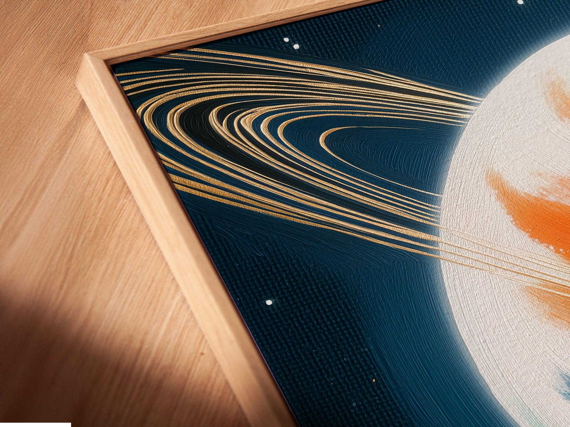 Close-up of a Saturn canvas print in a floating frame. The space canvas appears to float adding depth to the galaxy wall art. This celestial decor accentuates modern spaces. The abstract print becomes a focal point. Ideal as bedroom art. A modern colorful art piece.