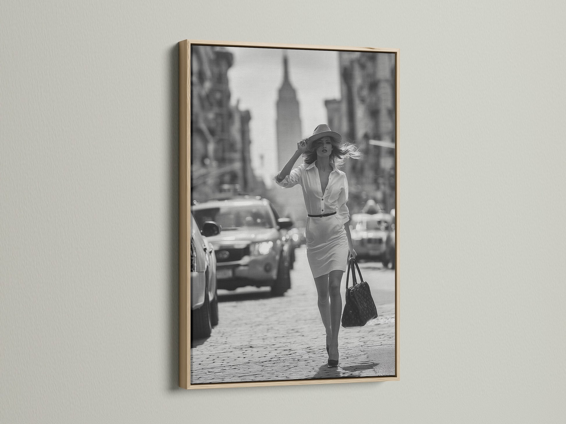 Enhance your artwork with our oak frame. This frame highlights a black and white photograph of a woman walking in a city. Our oak frames add warmth and sophistication to any room. Find the ideal frame for your cherished art.