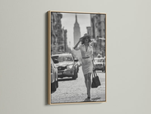 Enhance your artwork with our oak frame. This frame highlights a black and white photograph of a woman walking in a city. Our oak frames add warmth and sophistication to any room. Find the ideal frame for your cherished art.