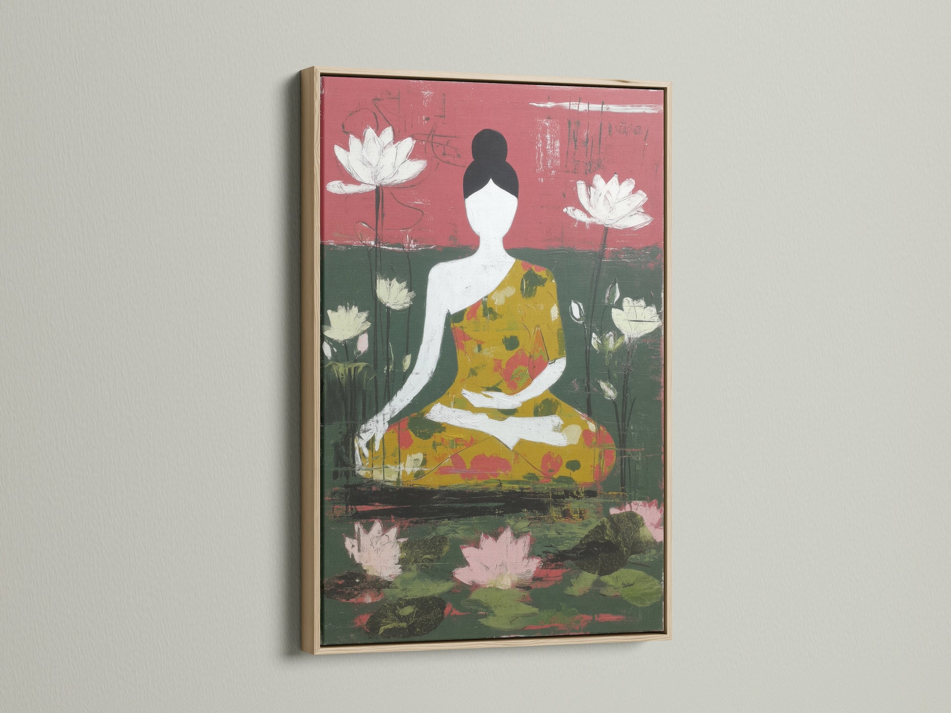 A framed meditation art piece with an oak frame hangs on a white wall. The artwork shows a seated Buddha amidst lotus blossoms. The print adds a touch of zen home decor to minimalist Scandinavian or eclectic spaces. Ideal for meditation rooms and wellness centers.