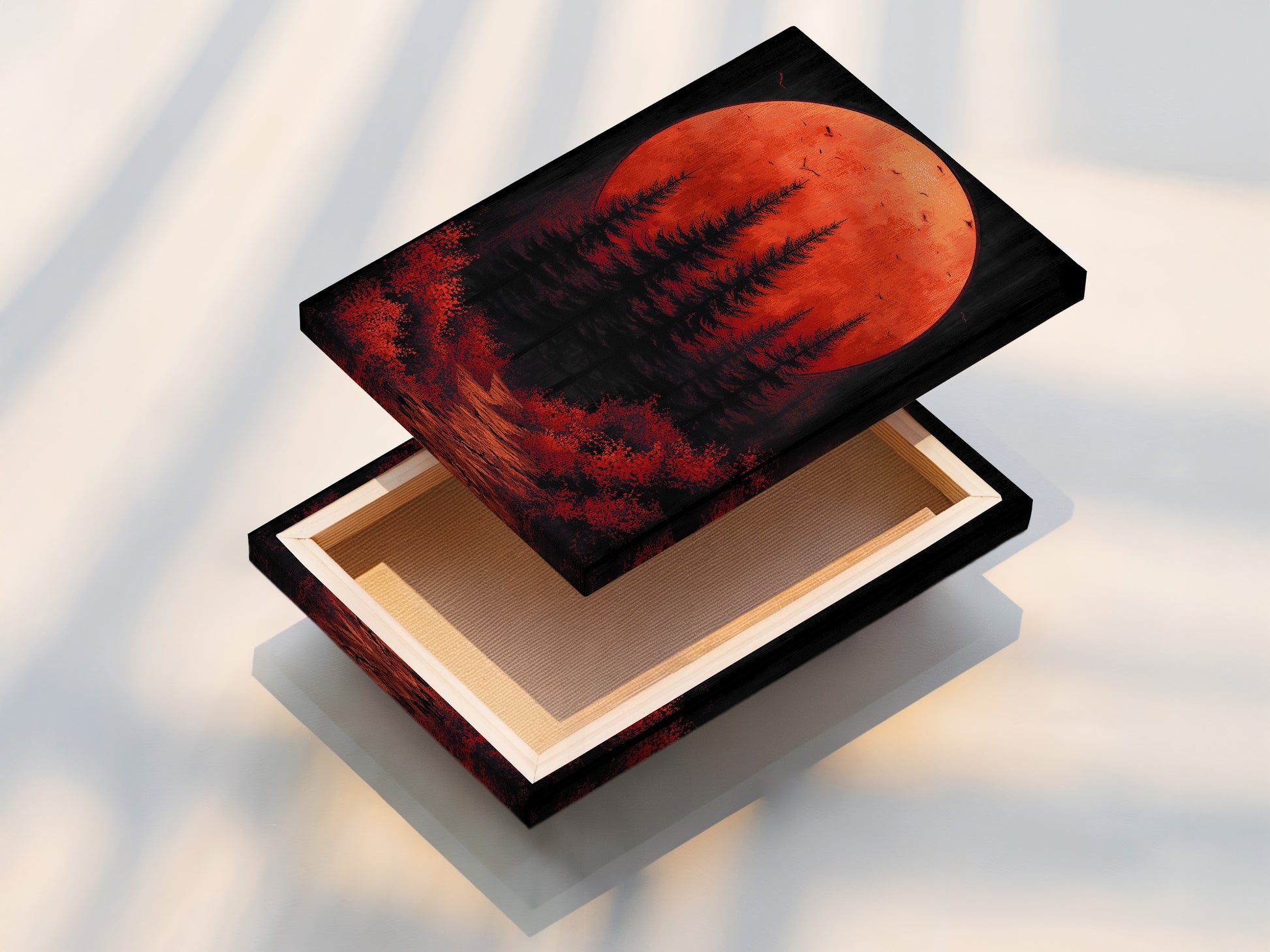 This is a stretched canvas print featuring forest moon art. The red orange sunset and moody landscape create a visually stunning piece. Ready to hang this stretched canvas print is ideal for living room wall art or bedroom decor. It enhances any space with its contemporary style.