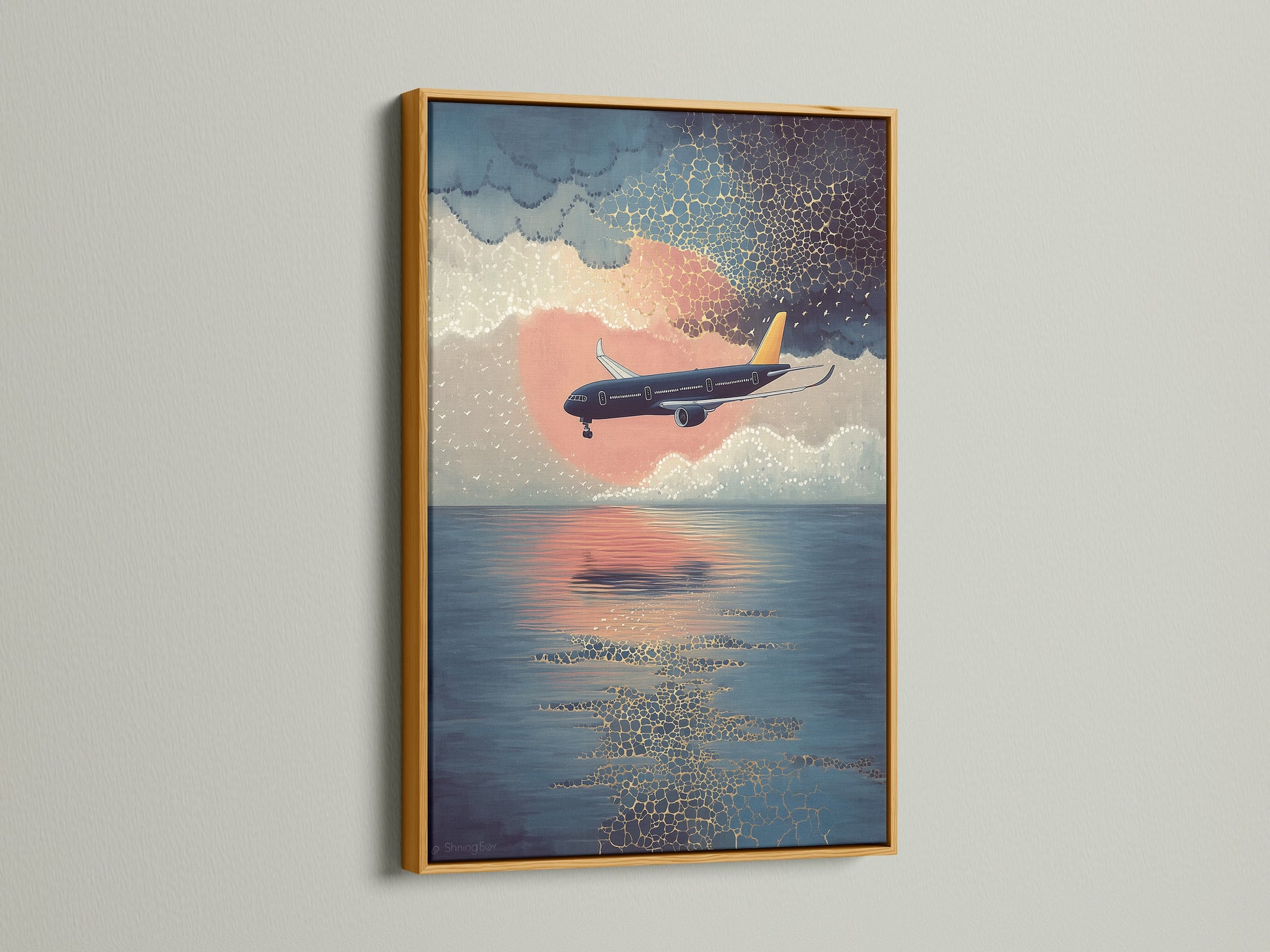Elevate your space with our airplane canvas print. This sunset flight wall art features a coastal sky artwork. It is displayed in a gold frame. Perfect aviation poster for office decor. A modern print that brings blue orange art to life.