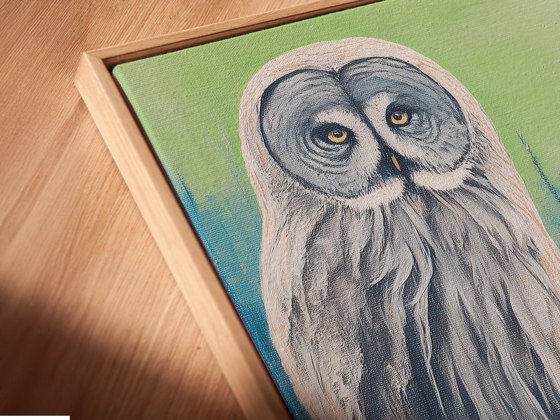 Close up angled view of a canvas print in floating frame. The floating frame gives the artwork a gallery-like feel. Perfect for showcasing this winter forest wall art. See the details of this woodland creature artwork.