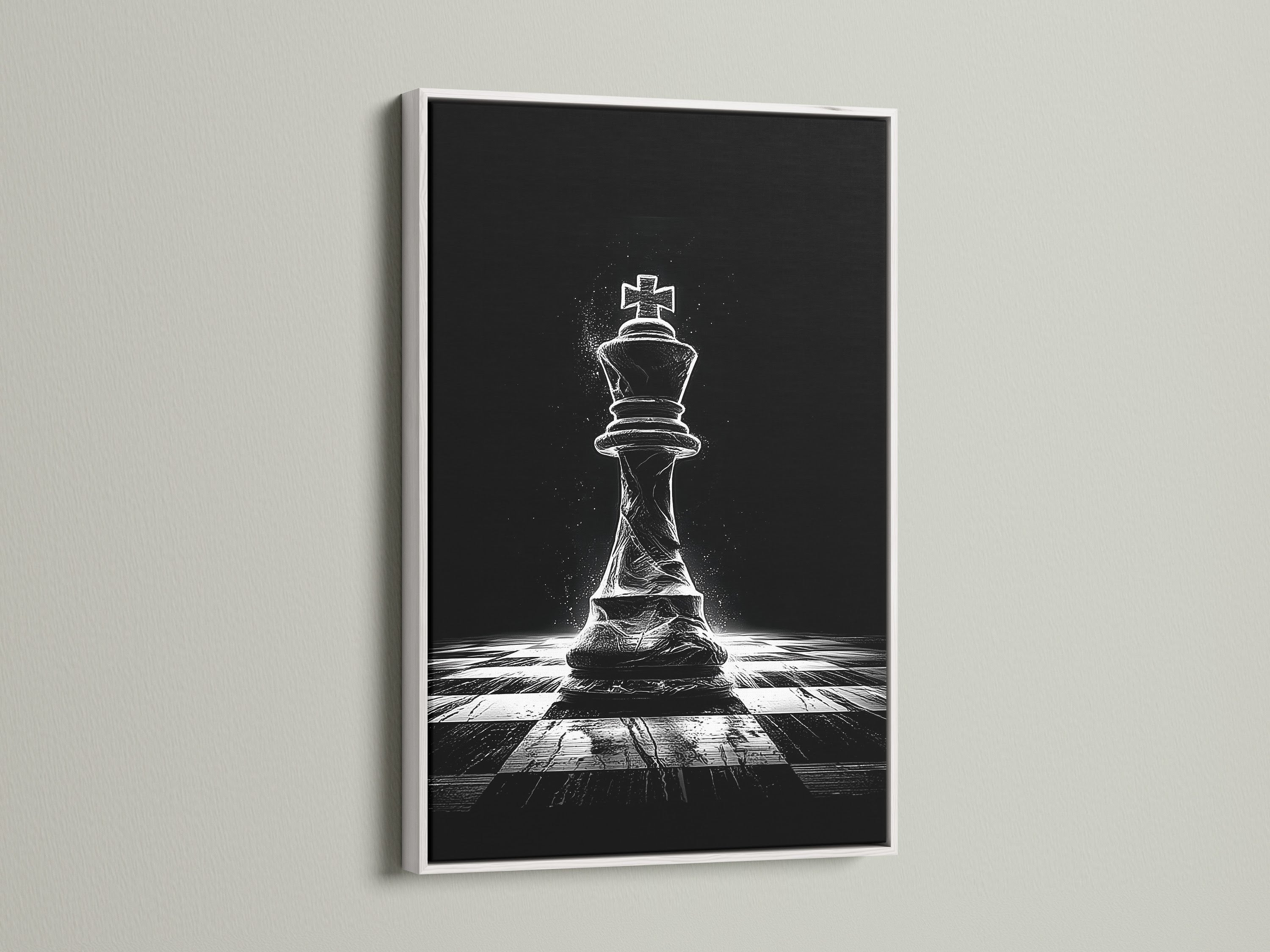 A striking chess king artwork is showcased in a white frame. The monochrome print creates a minimalist aesthetic. It's great for living rooms bedrooms or offices. The white frame complements the black and white art.