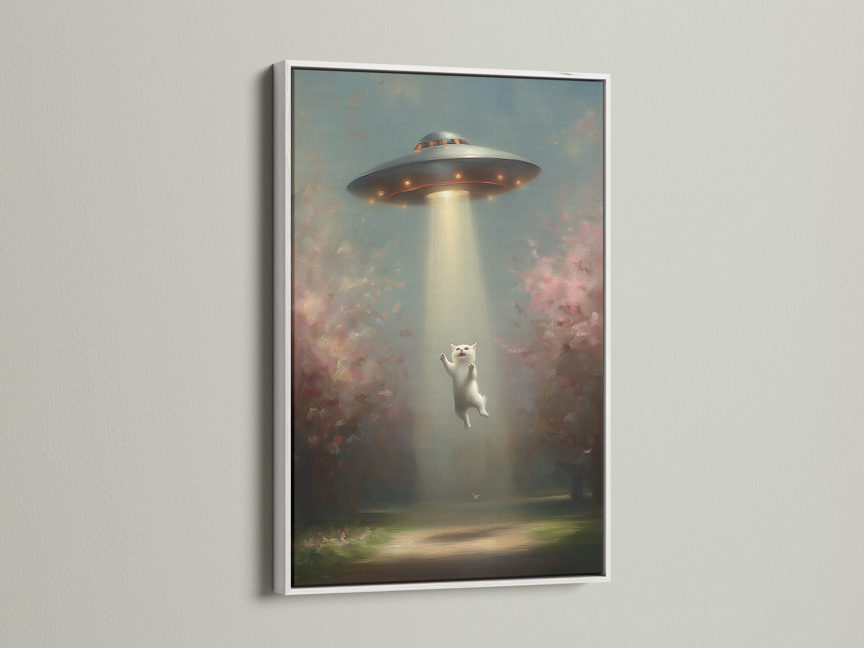 UFO Cat art in a white frame creates a clean modern look. This funny cat art is perfect for minimalist decor. The alien abduction artwork is a conversation starter.