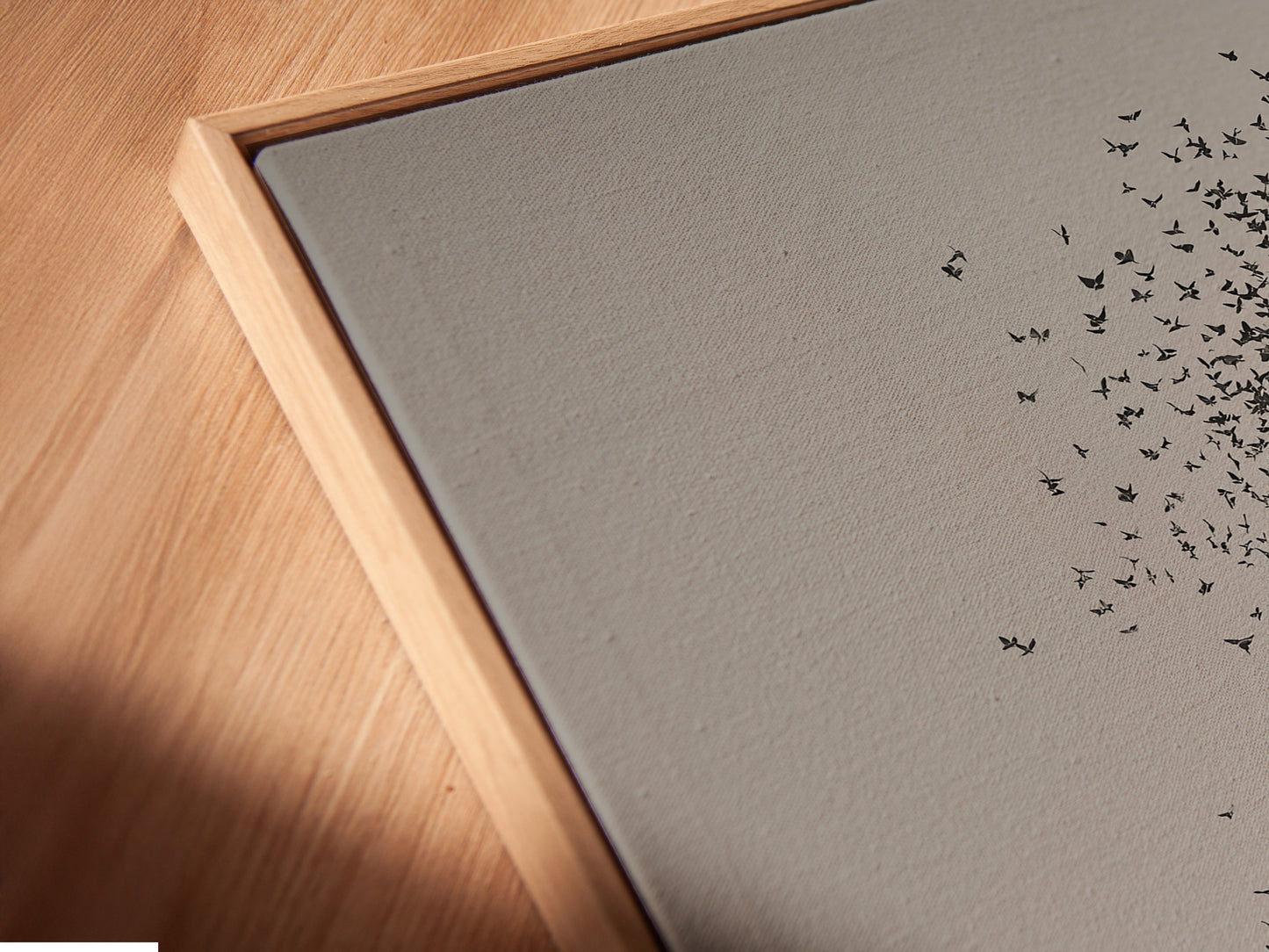 A close-up of a canvas print in a floating frame. The art appears to float within the frame. This creates a modern and stylish look. The floating frame enhances the artwork's visual impact. It's a unique way to display your favorite pieces. Discover the beauty of floating frames.