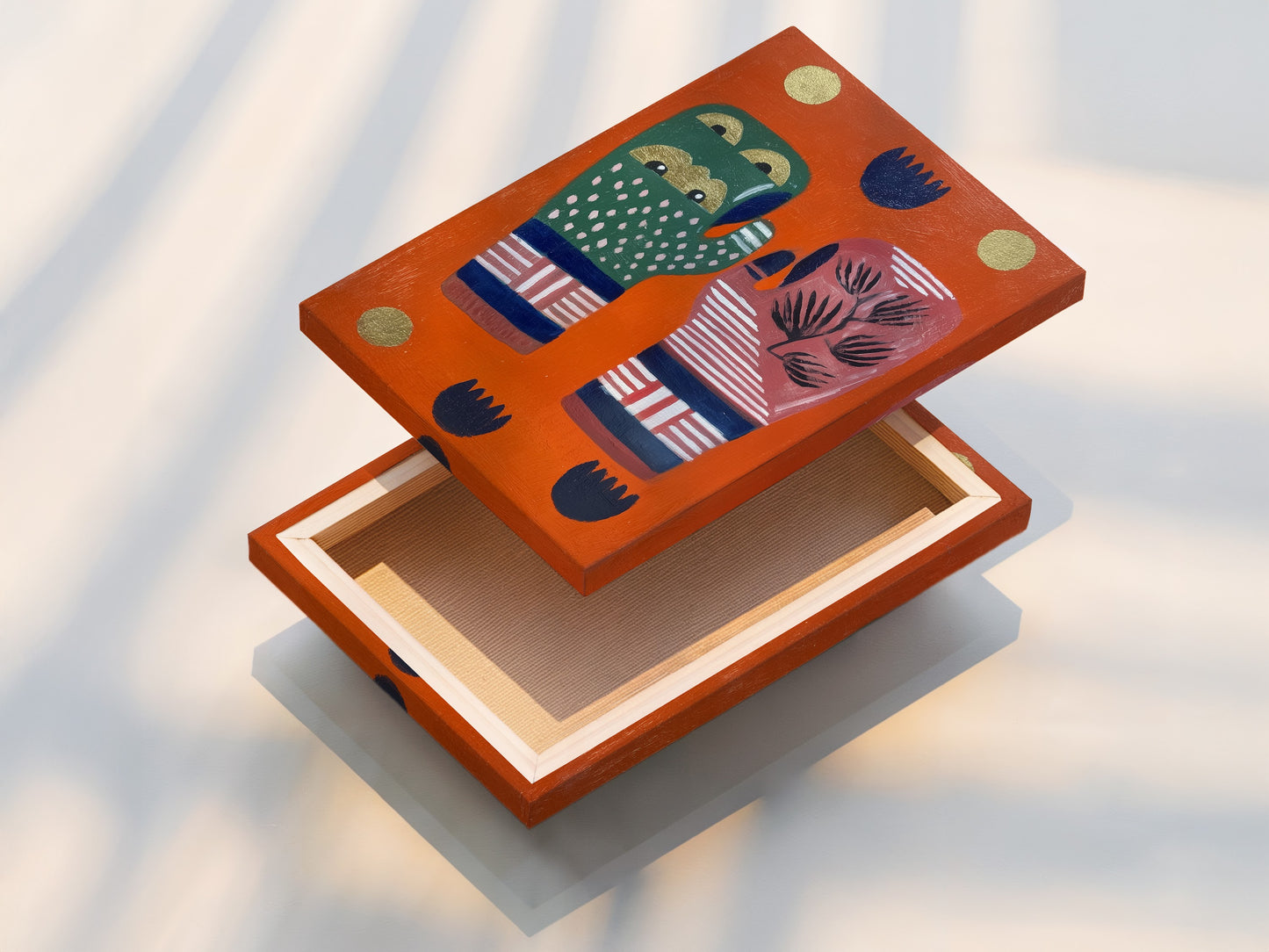 A stretched canvas print showcases the abstract hands artwork. The colorful graphic elements and modern folk art details are beautifully displayed. The stretched canvas provides a gallery-ready look. It is perfect for living rooms coffee shops and boutique decor. This piece adds a vibrant and unique touch to any room.